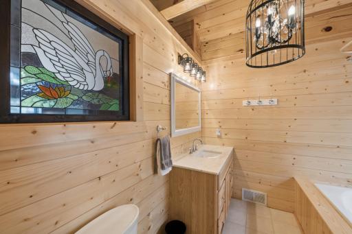 Large full bathroom as part of the primary suite.