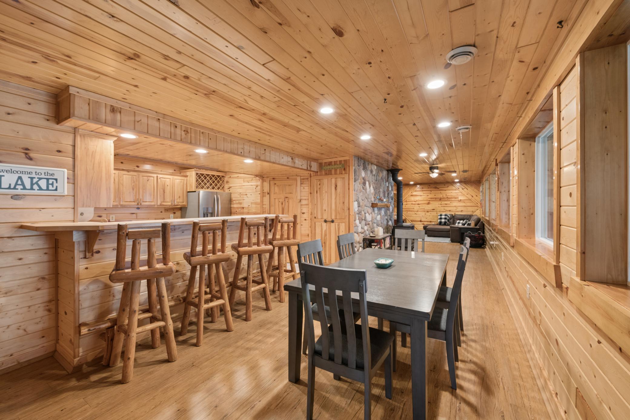 The lower level has all of this sitting space right outside (or bar height seating) of the kitchen area.