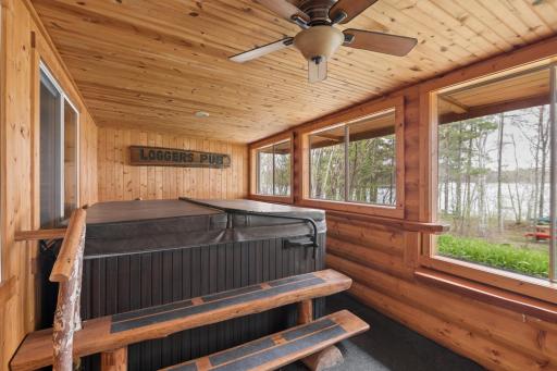 Can you say HOT TUB overlooking the lake right in a 3-season porch area?