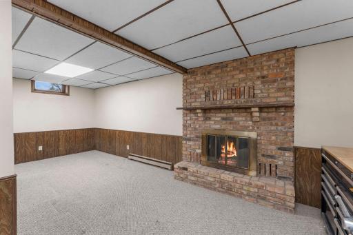 Lower level is finished and has the second wood burning fireplace.