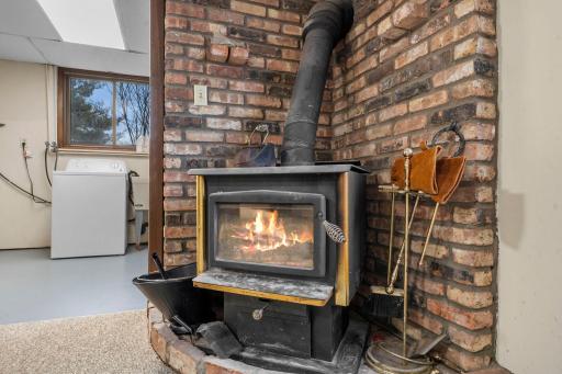 Wood stove in the lower level is only steps from the walkout.