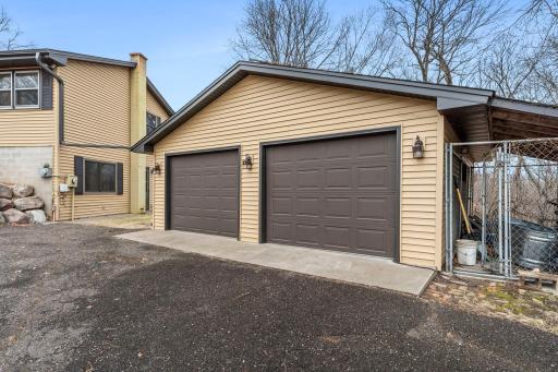 Detached garage also has a dog kennel on the side.