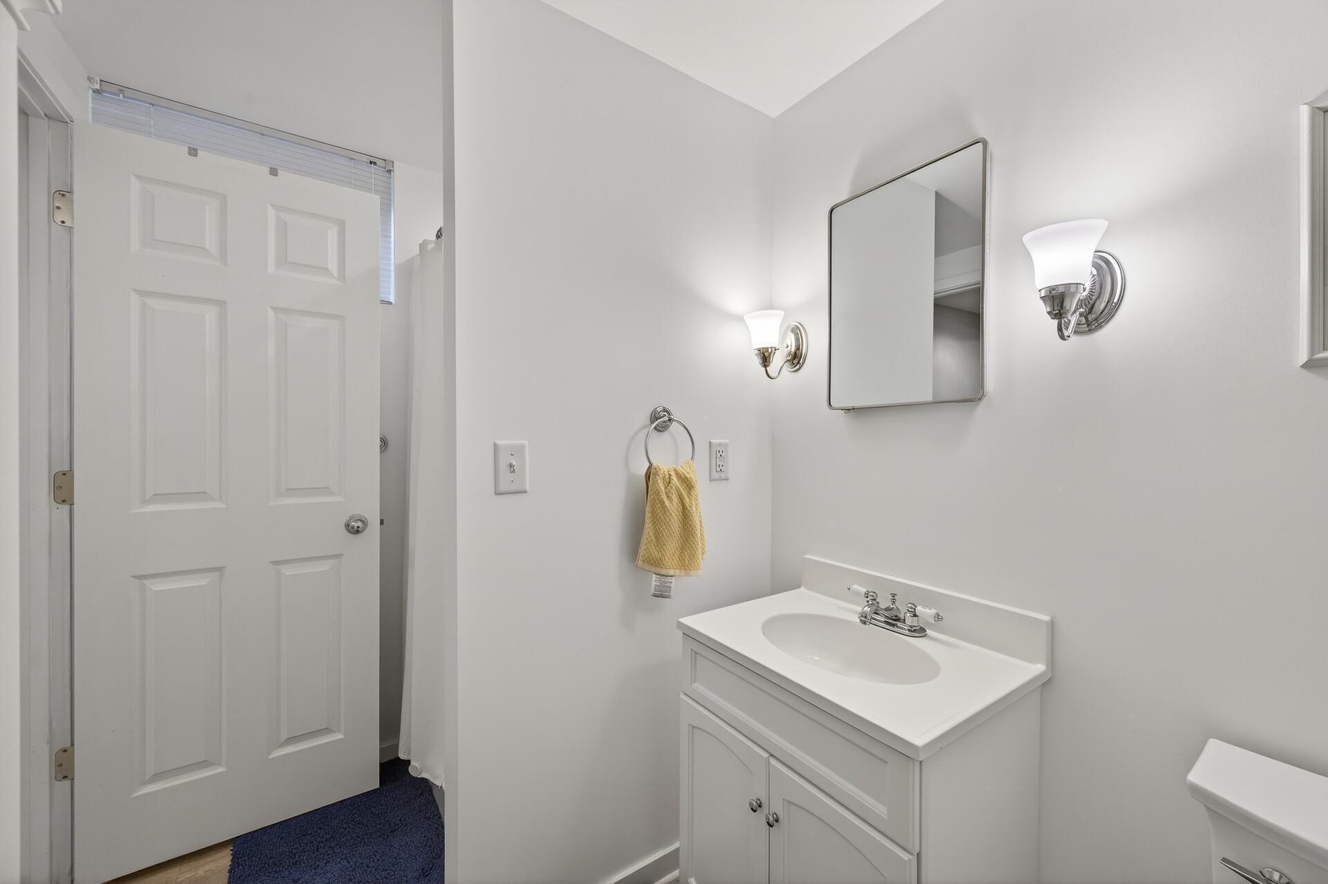 Lower level 3/4 bath with vanity sink.