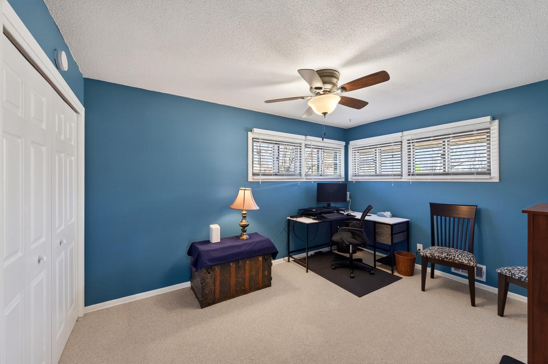 2nd main level bedroom with corner windows.