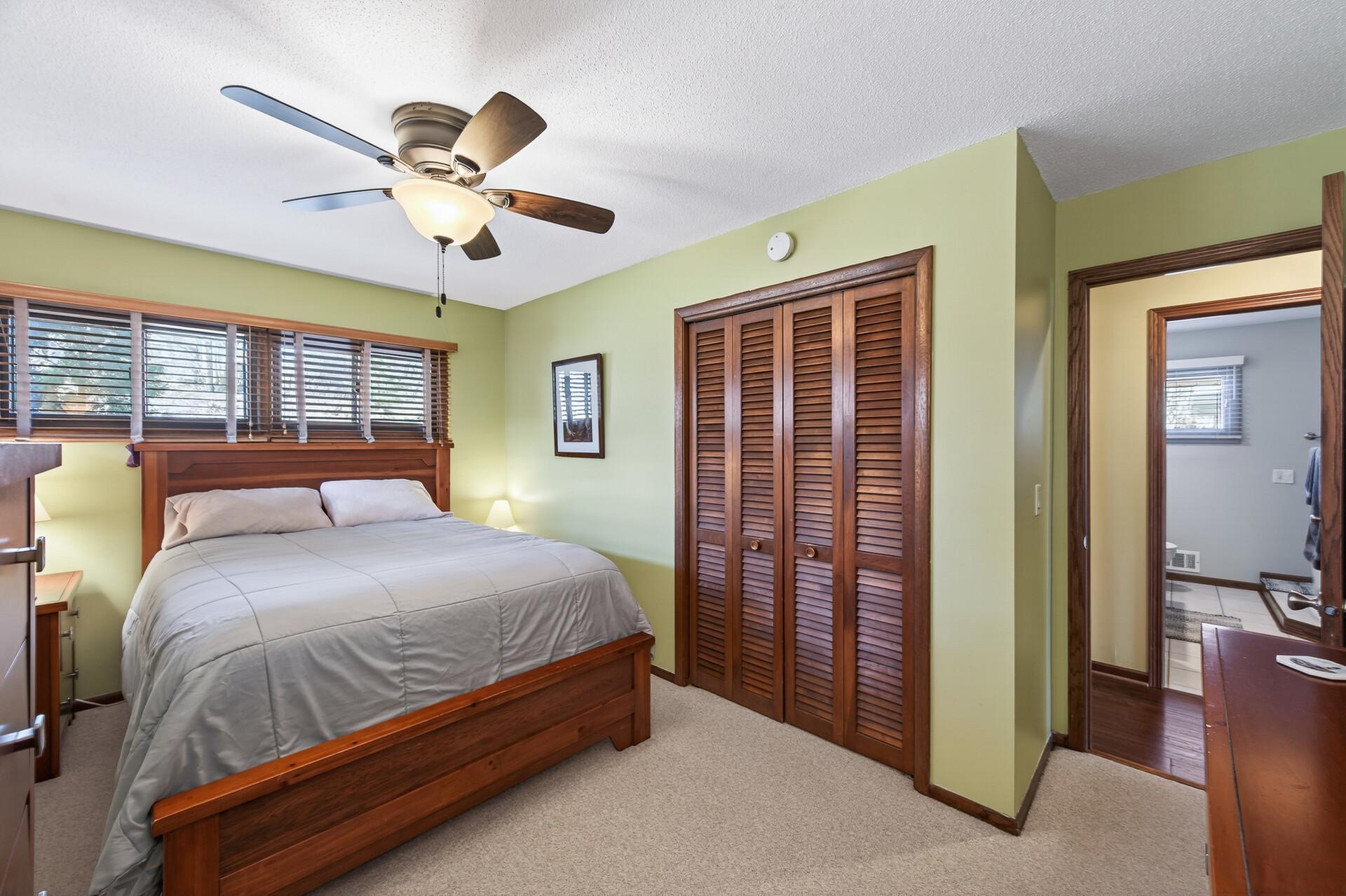 Wood louvered closet door.