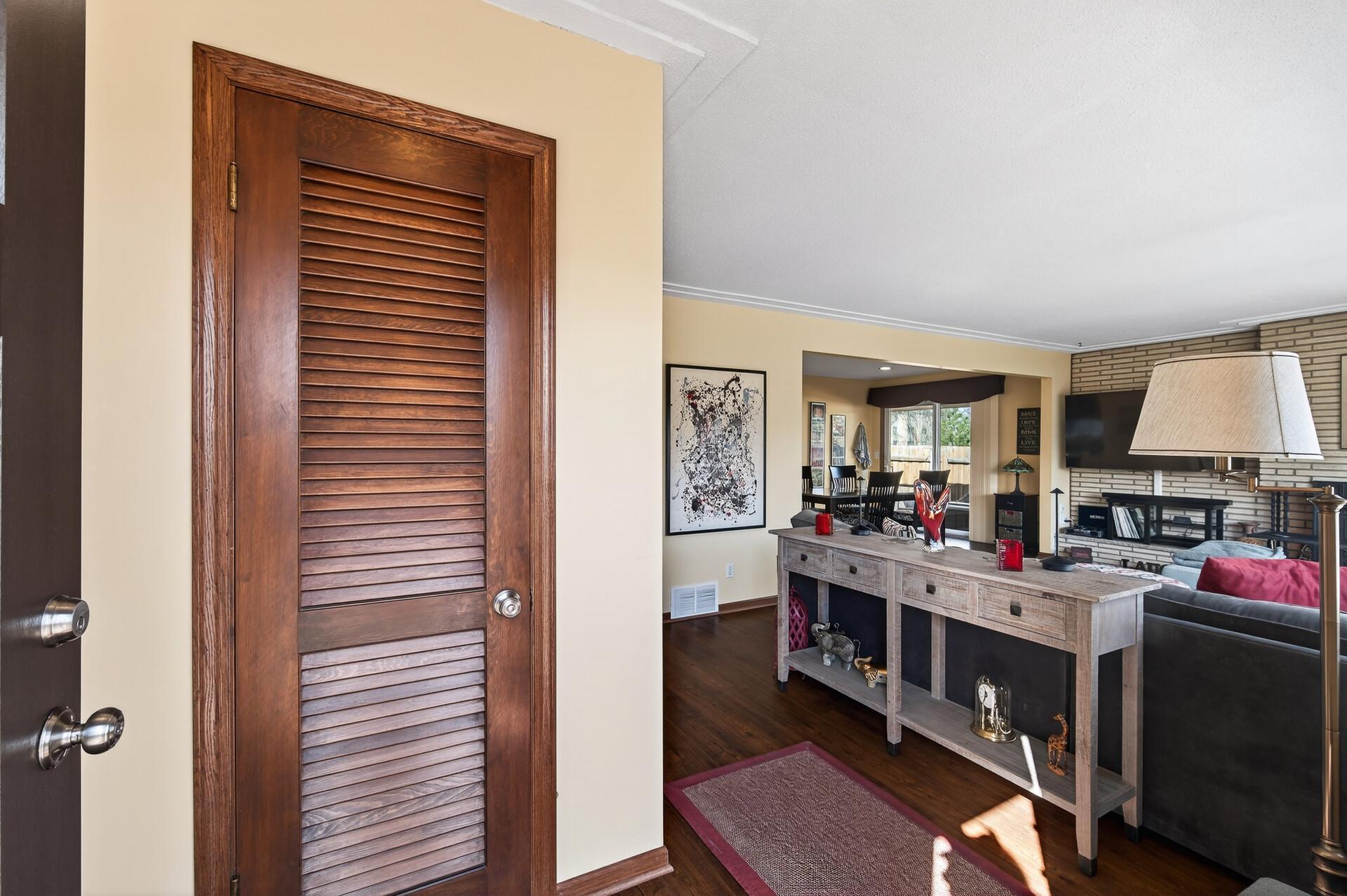 Welcoming foyer with coat closet.