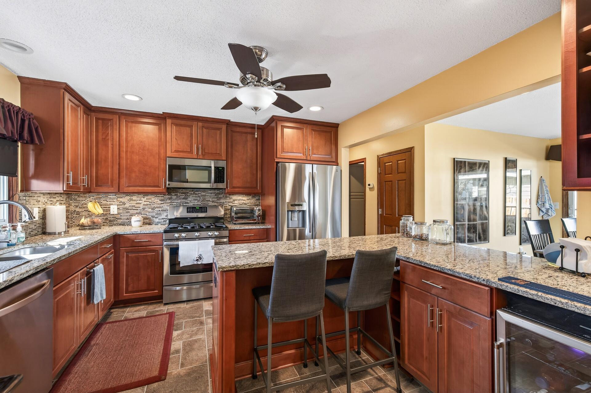 Ceiling fan and recessed lighting.