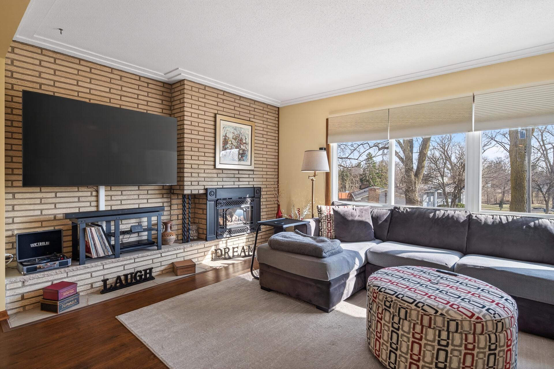 Stunning brick wall gives the room a mid-century mod vibe.