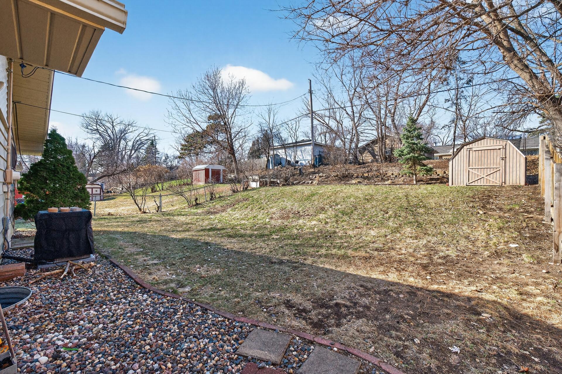 View of backyard coming from the deck.