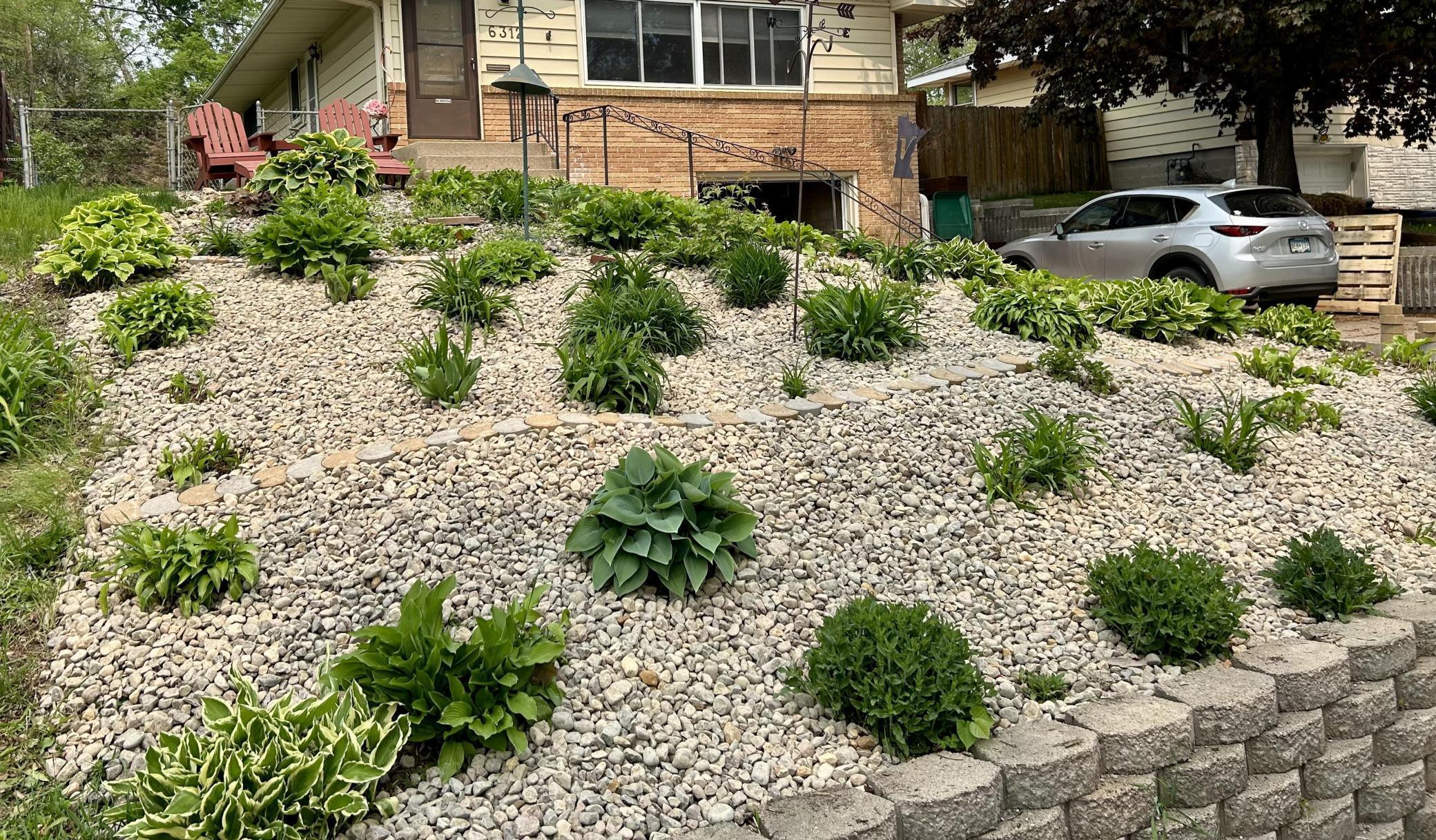 Summer photo of the front rock garden for easy maintenance.