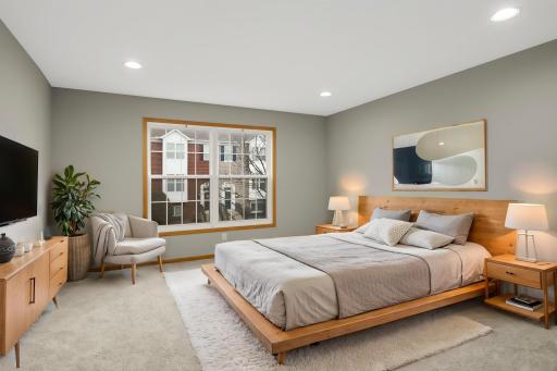 Spacious primary bedroom with walk-in closet- virtually staged