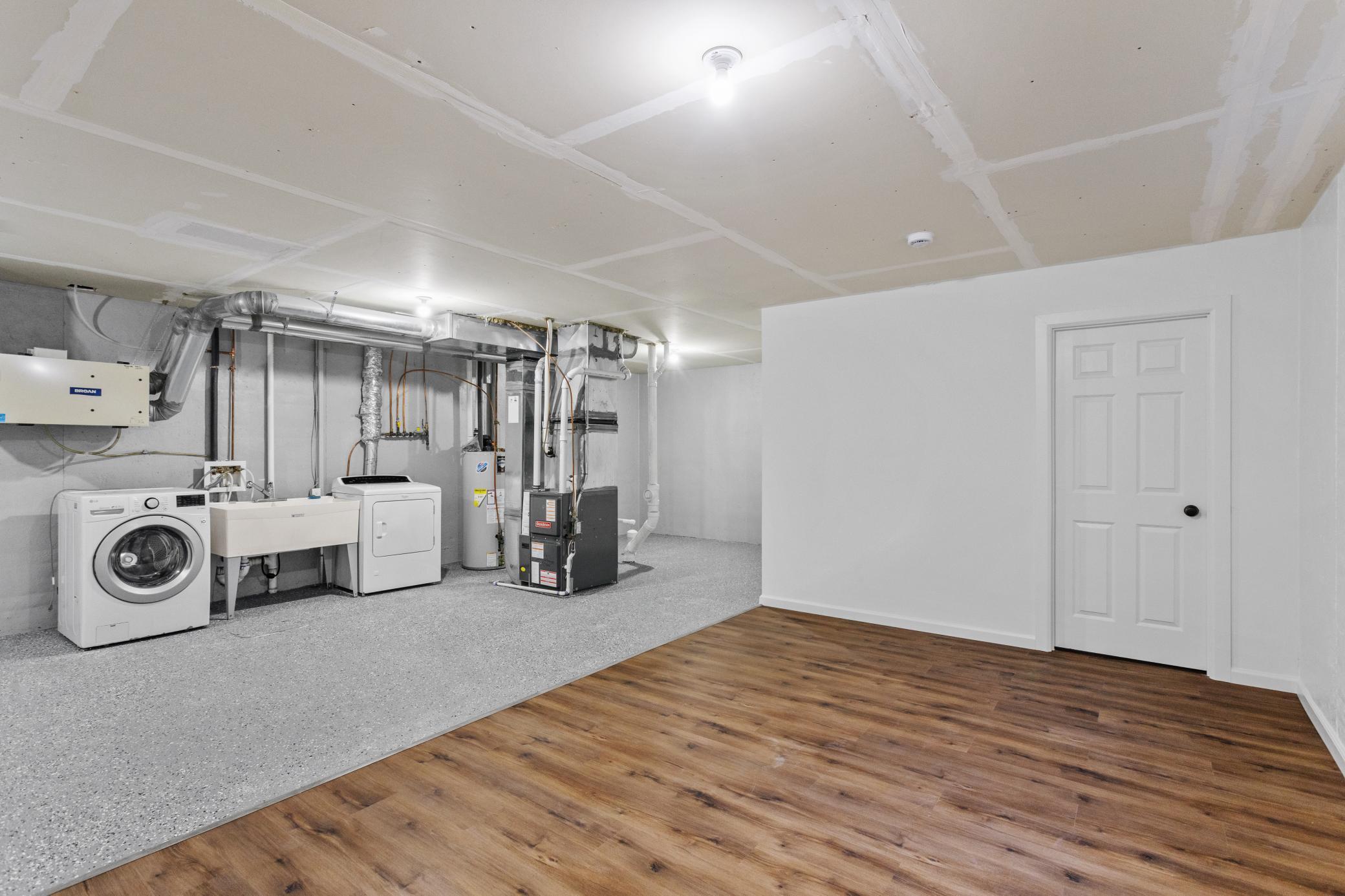 Lower Level Recreation Room open to the laundry/mechanical area