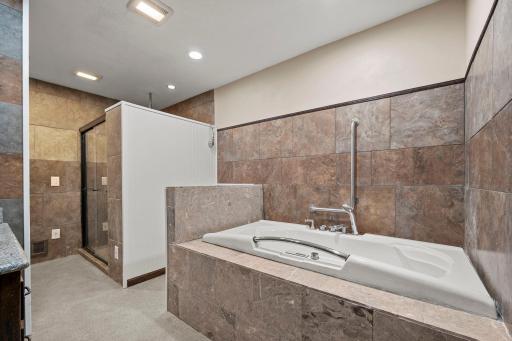 Upper level full bath with separate shower and jetted tub