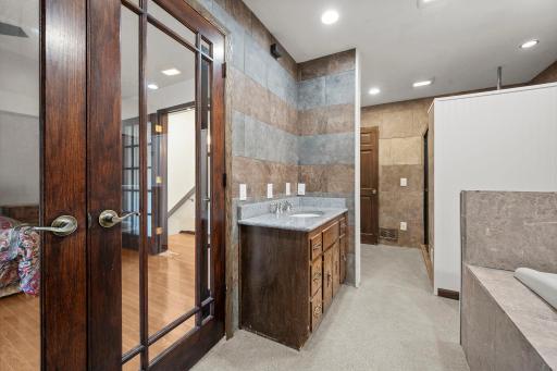 Upper level full bath with separate shower and jetted tub