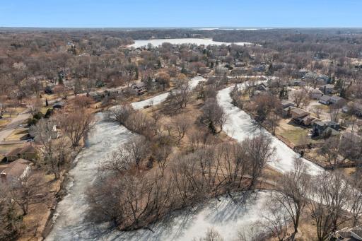 Just steps from Green Tree Island! Enjoy scenic trails, charming bridges, and peaceful water views right in the neighborhood.