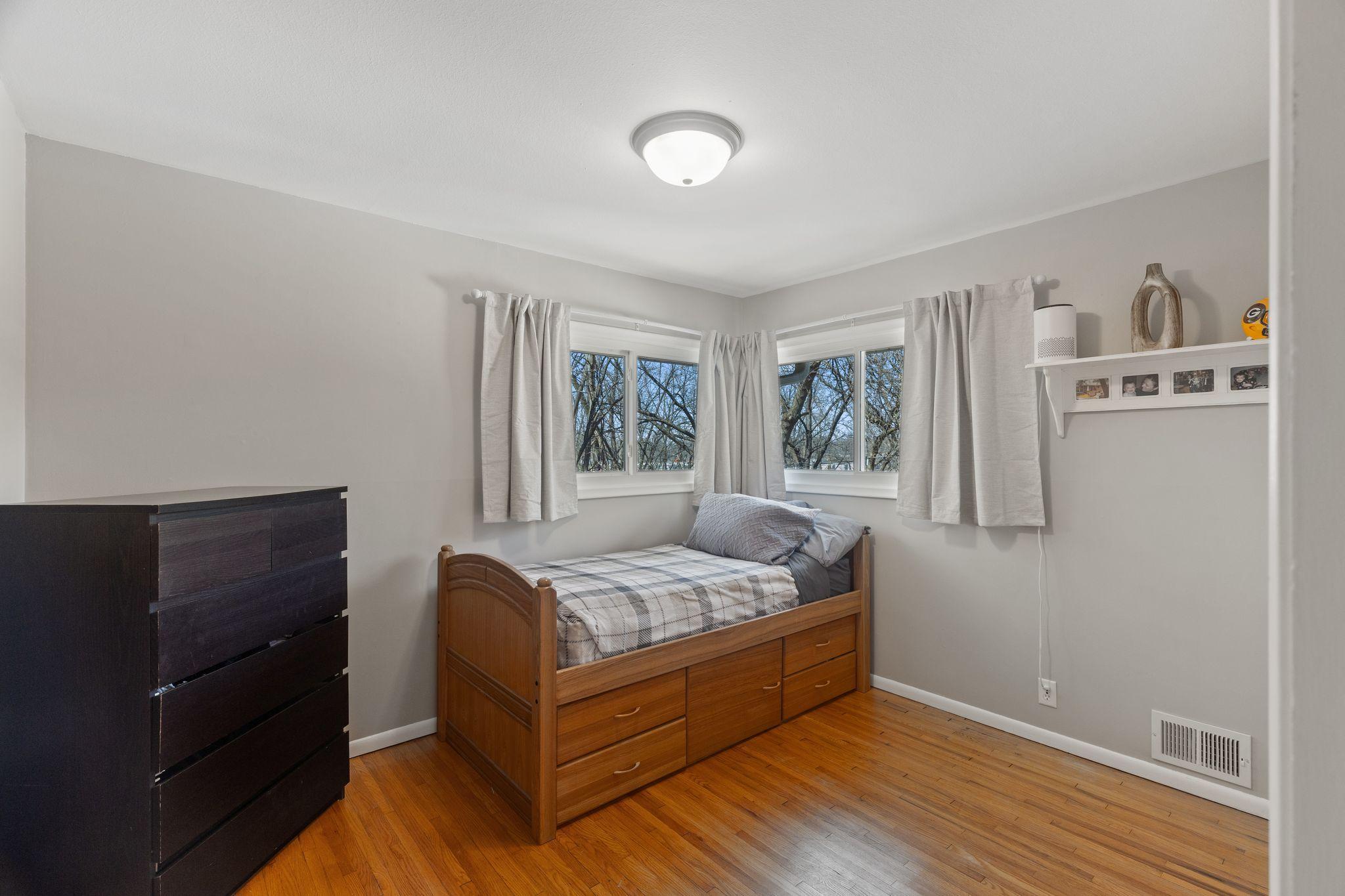 Bed 2 on main level. Lots of natural light and beautiful hardwood floors
