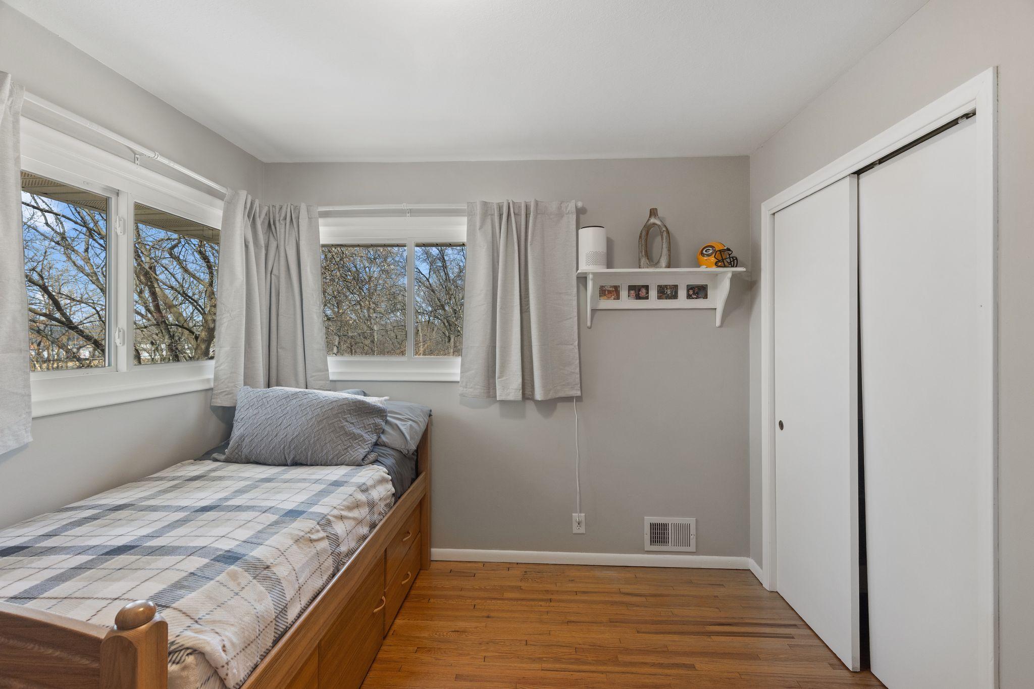 Bed 2 on main level. Lots of natural light and beautiful hardwood floors