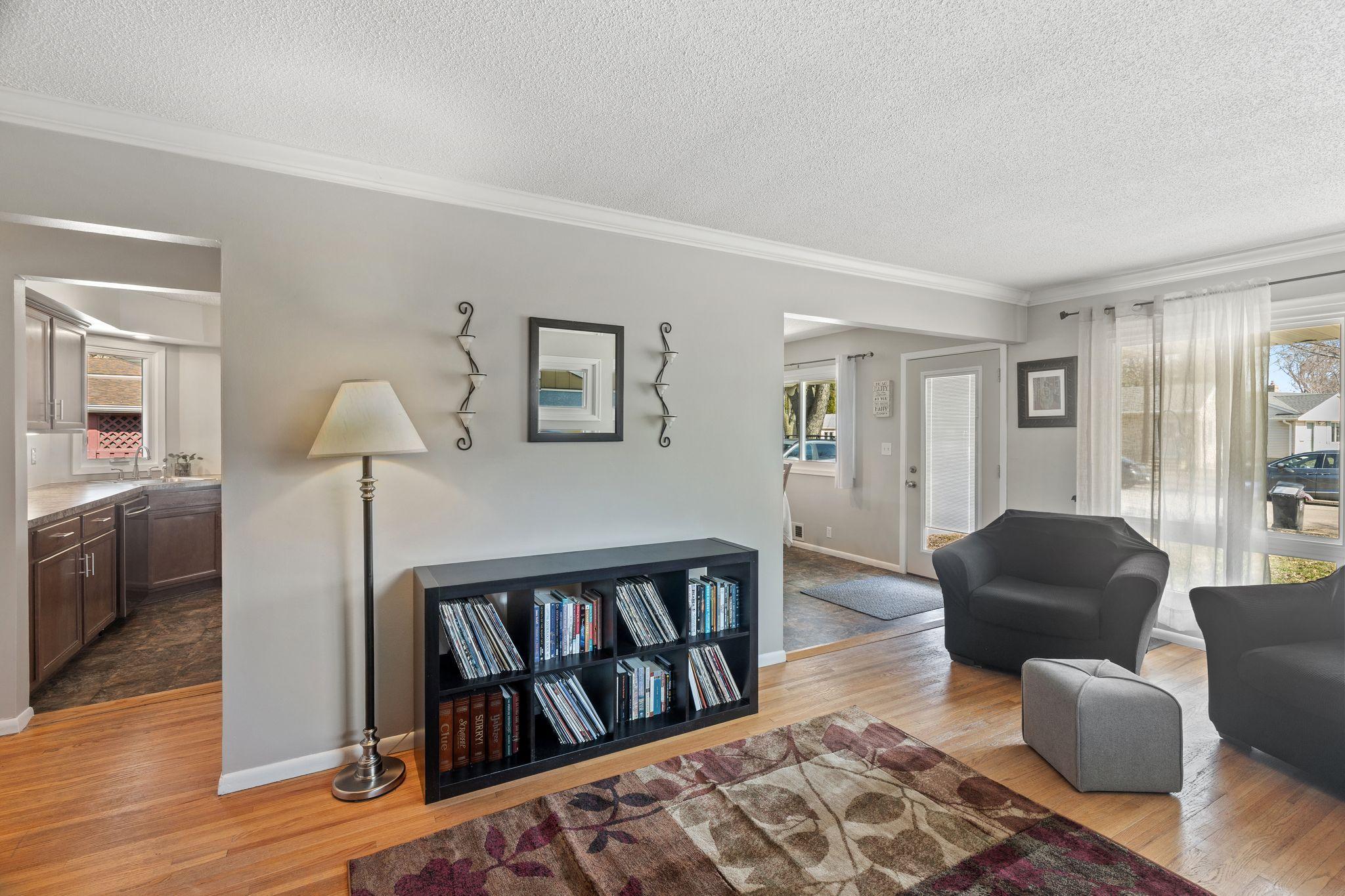 cozy living room open to the informal dining room and kitchen