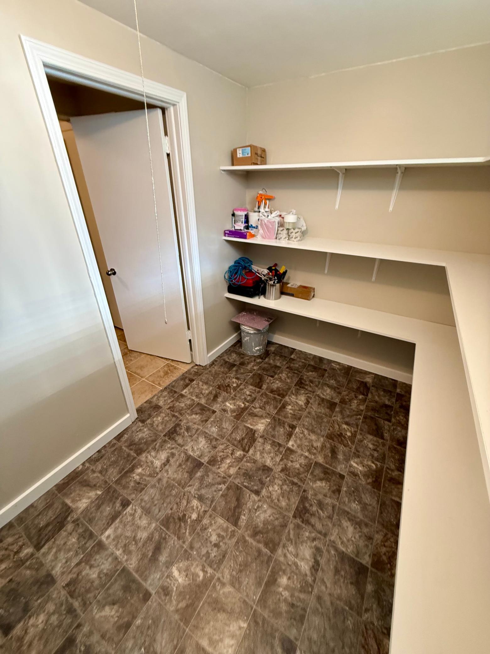 Large lower level storage room. Could be used for office