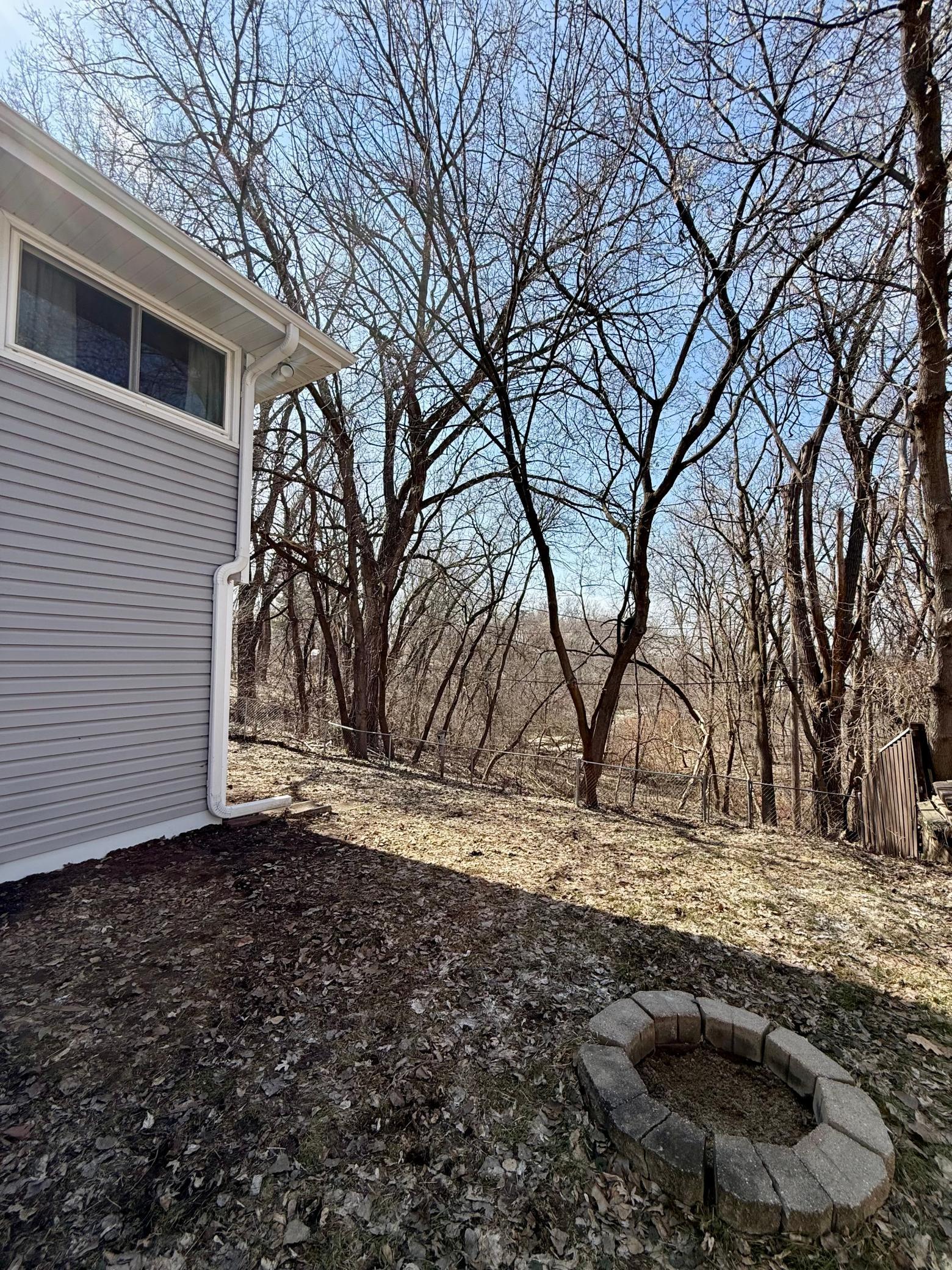 private backyard overlooking creek/wooded area