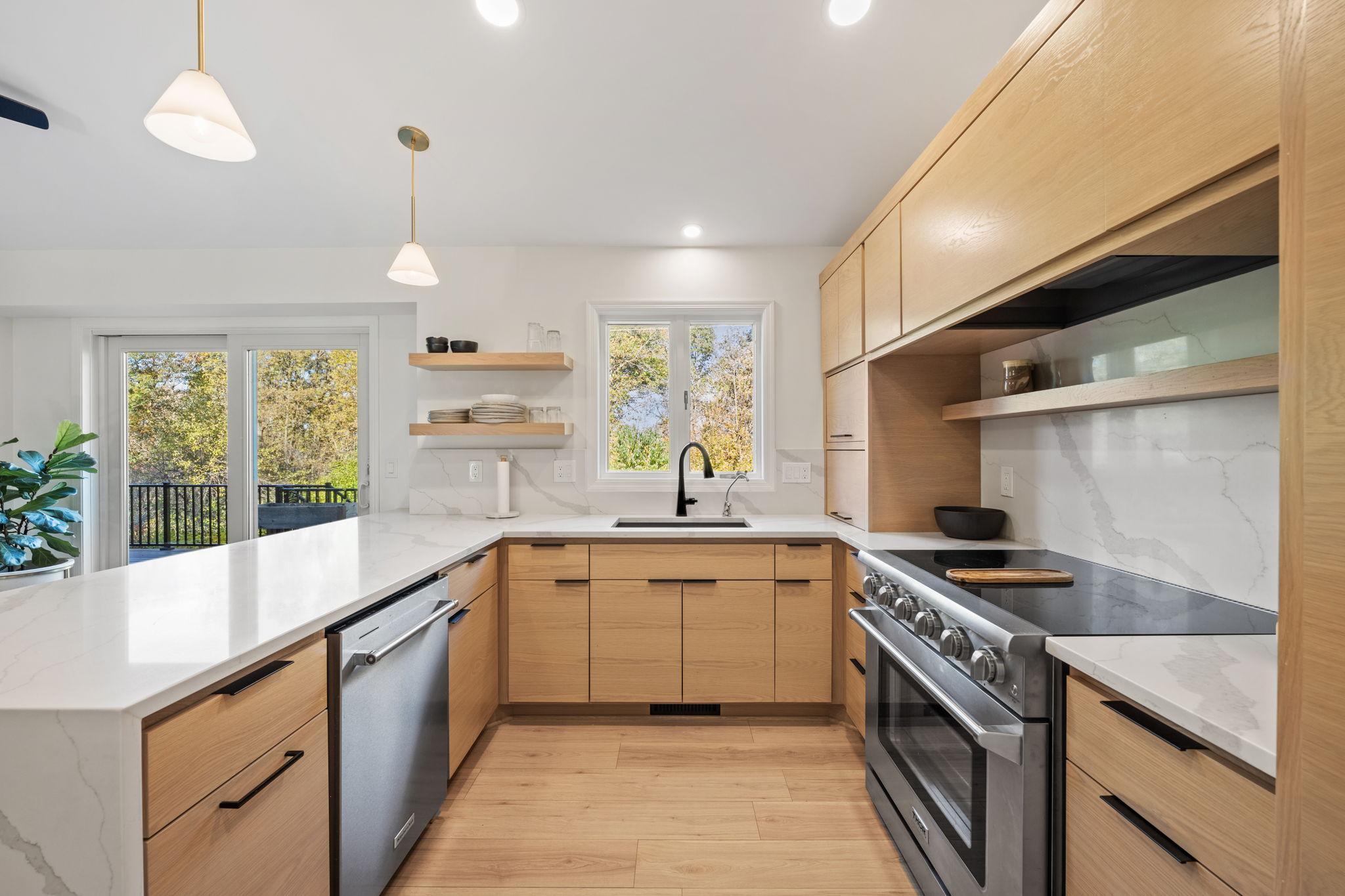 Efficient u-shape design makes for great cooking experience. A beautiful view of the back yard overlooking the river from this kitchen window!
