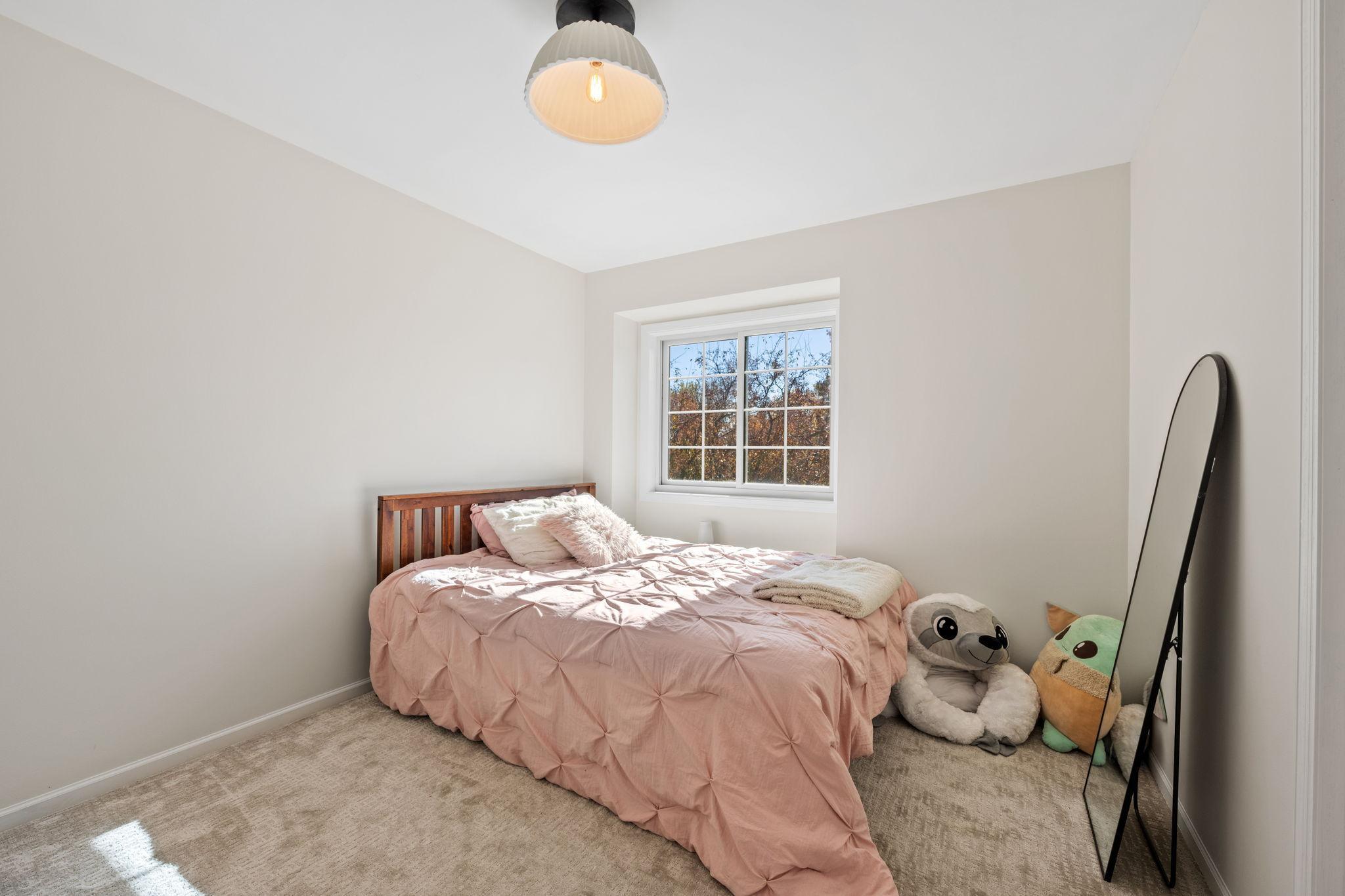 Upstairs bedroom. The whole house has been recarpeted and painted.