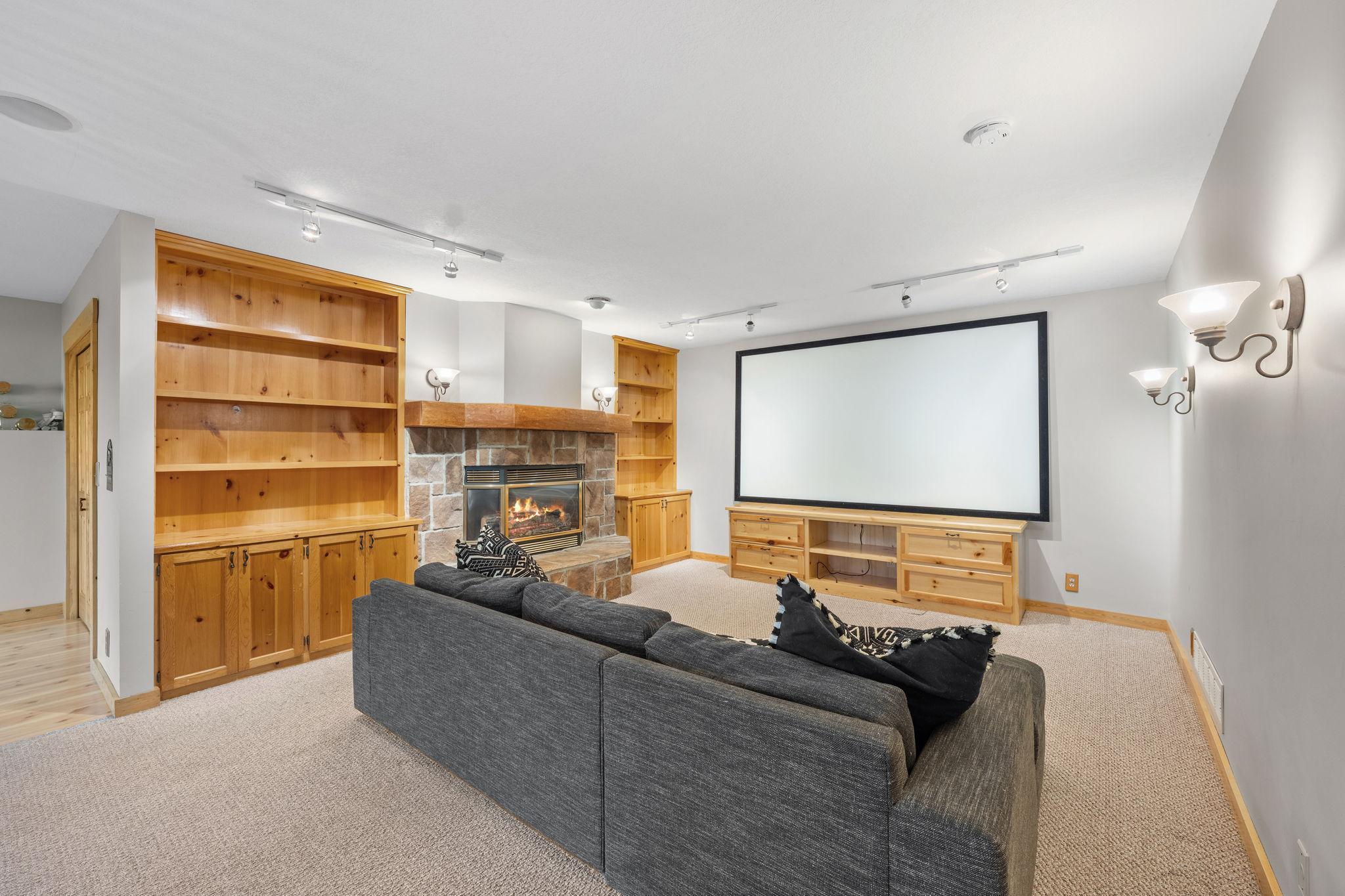 Lower level family. room with hickory built-ins and warm gas fireplace.