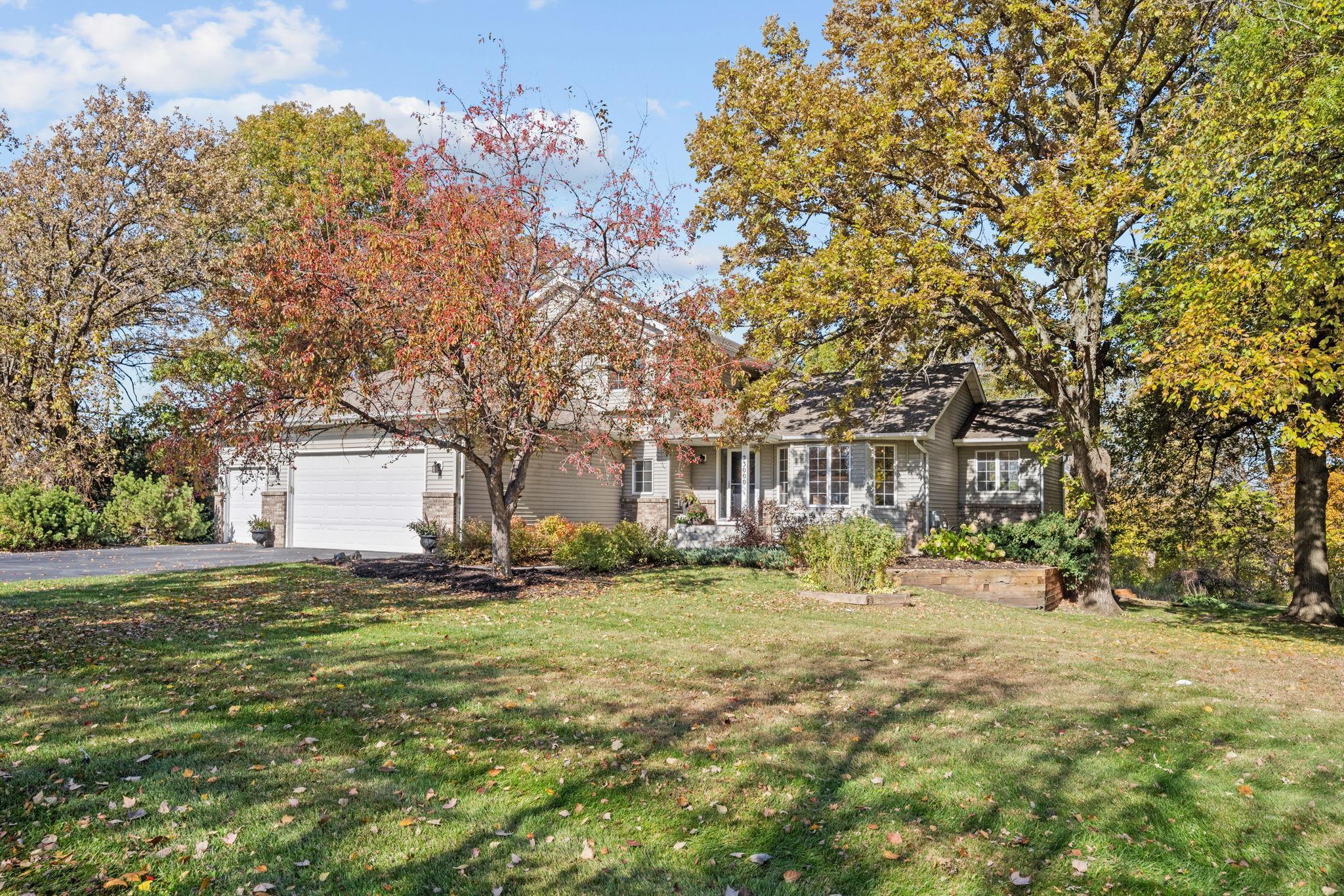 Beautiful 2 acre lot has colorful fall leaves and professional landscaping.