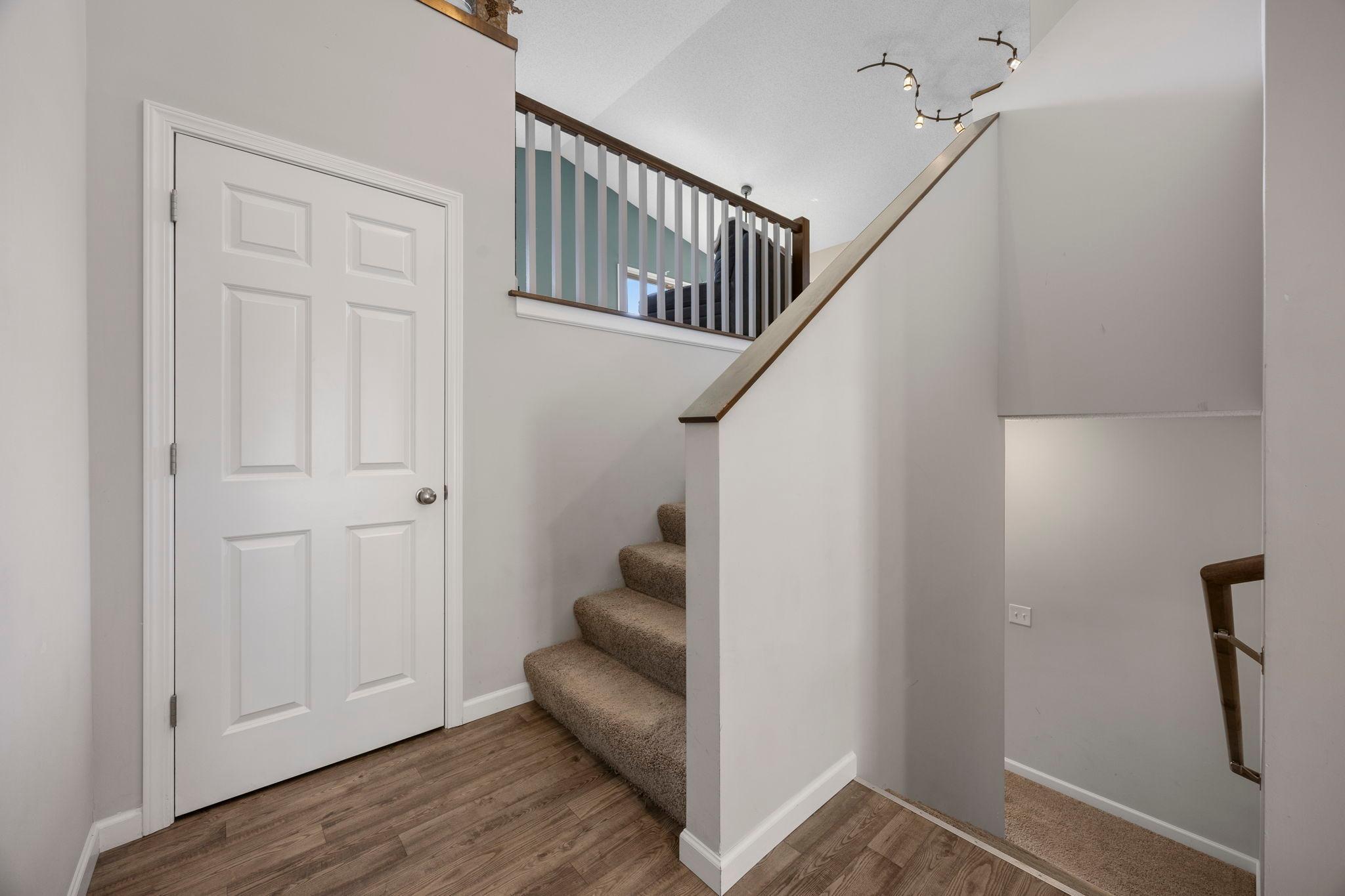 Off the foyer, stairs lead to both the main and lower levels