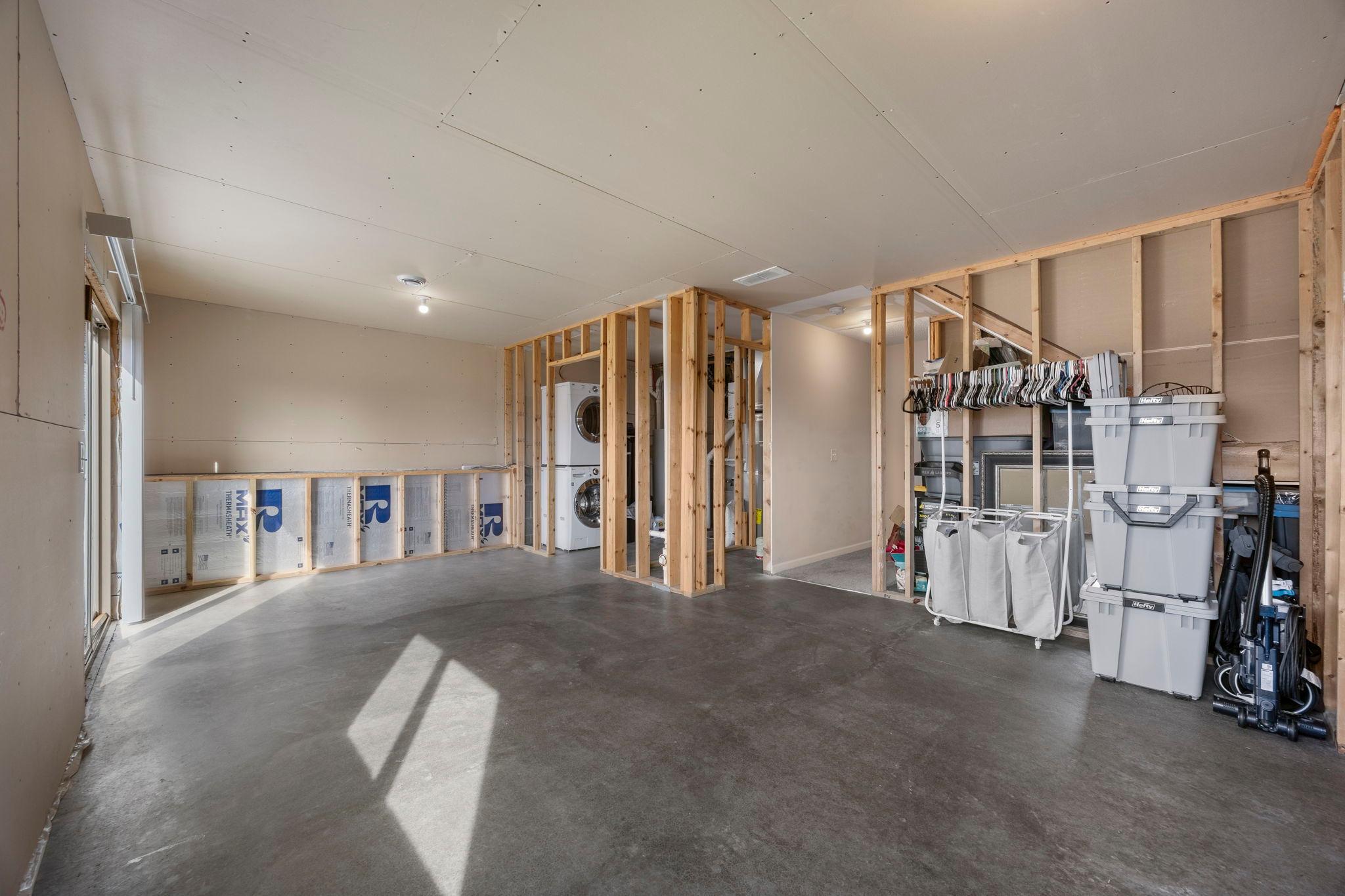 The lower level is unfinished & framed, offering a blank canvas to add your personal touch and build equity