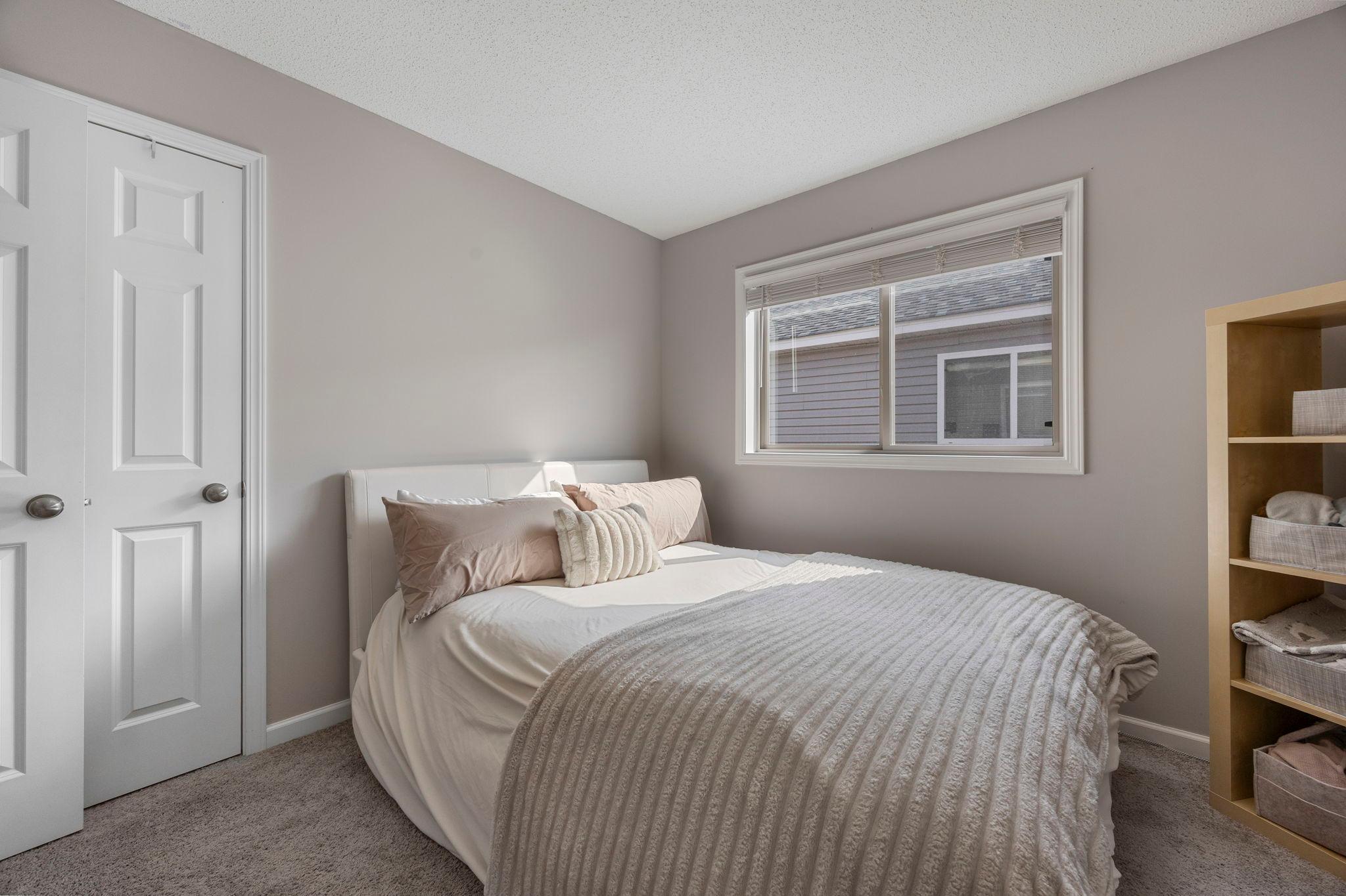 Upper level bedroom 2 with walk-in closet
