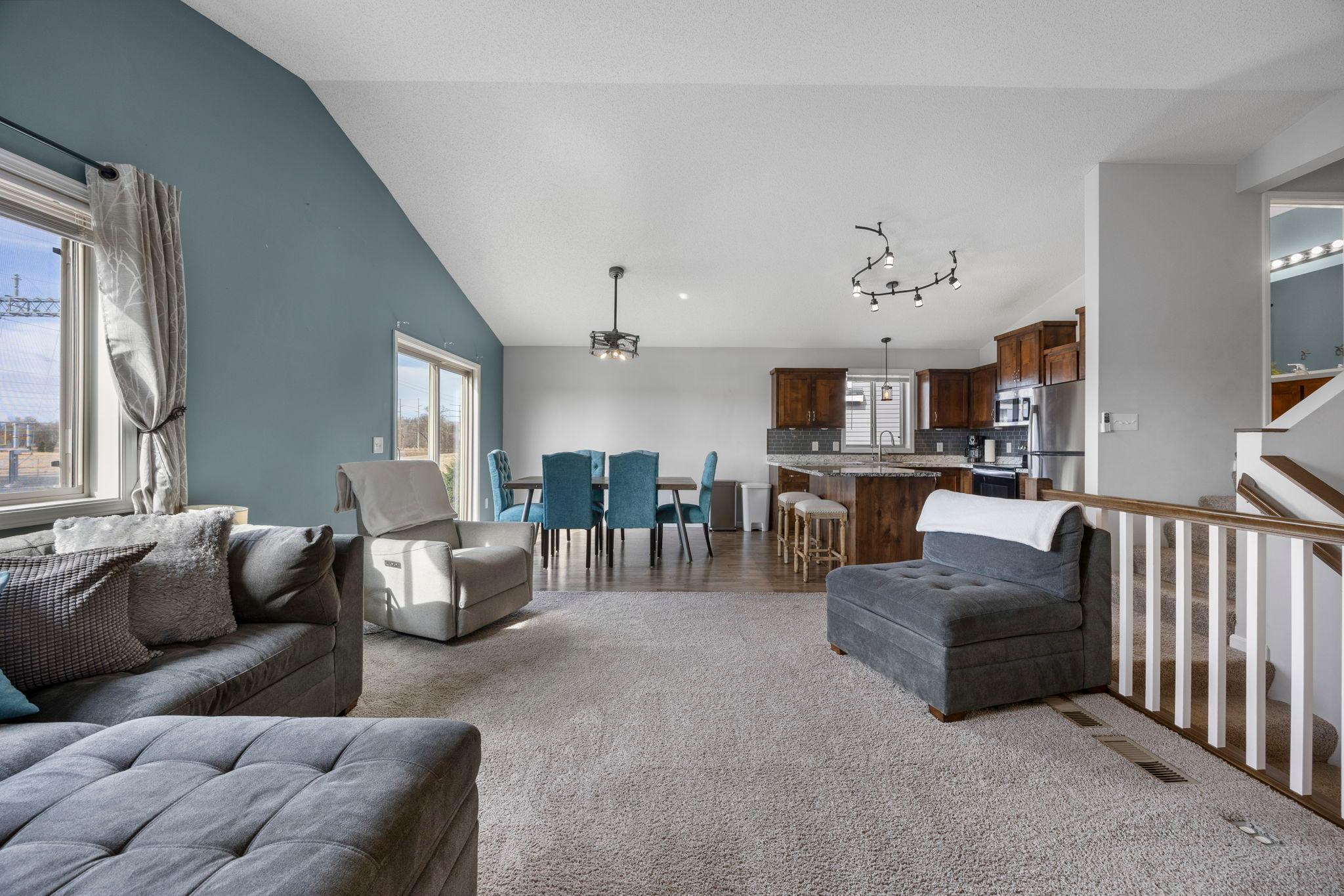 The open main level offers an easy, functional living space and is filled with natural light