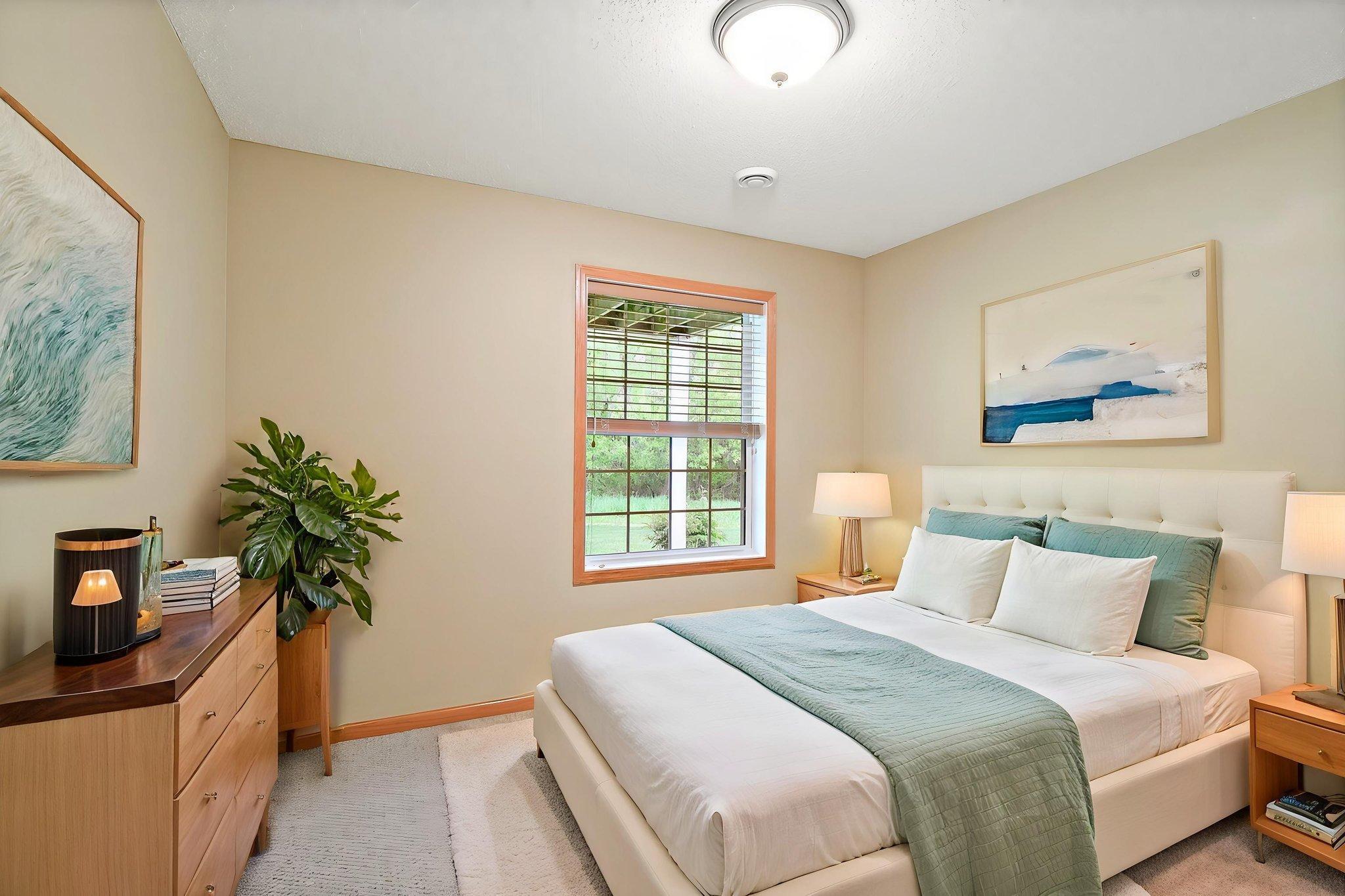 Third bedroom in the lower level offering comfortable space, natural light, and flexible use as a guest room, office, or additional retreat. Virtually staged