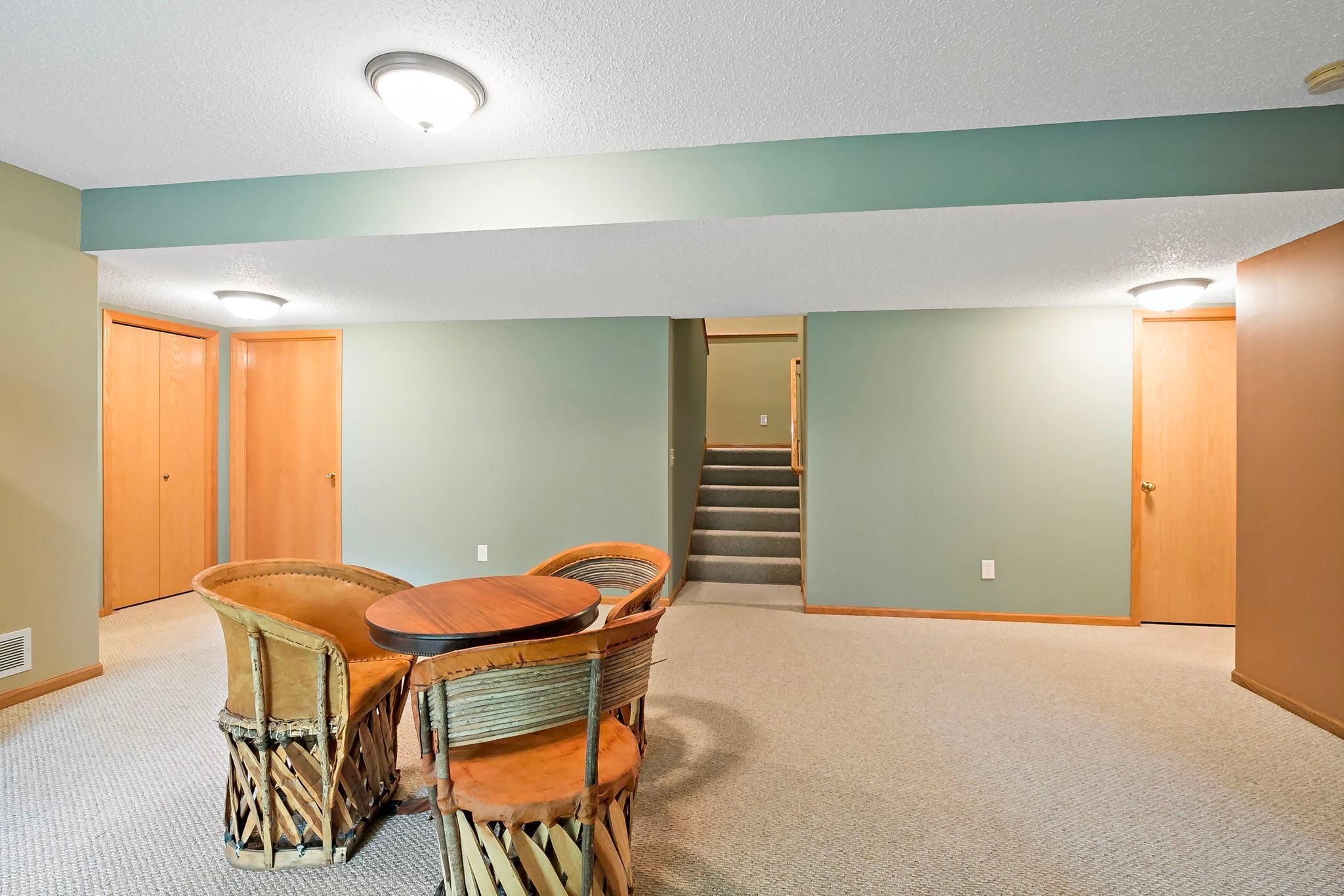 Another view of the lower level showcasing the expansive layout and flow between all rooms, highlighting the generous space and versatility throughout.