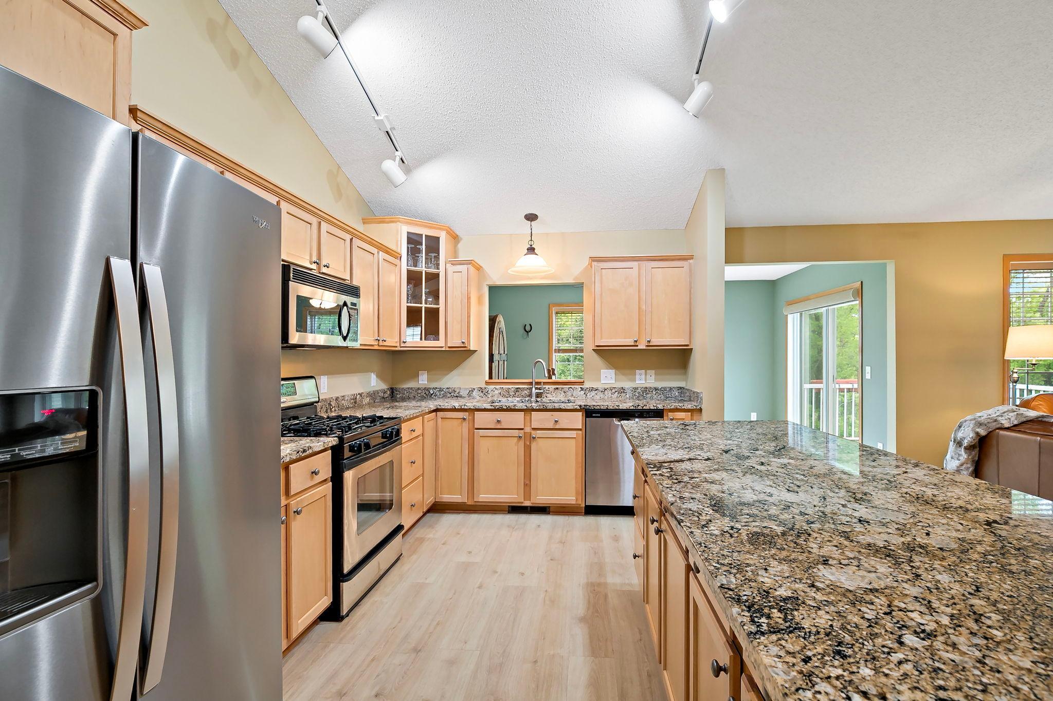 Enormous kitchen wiht vaulted ceilings and openness to all rooms