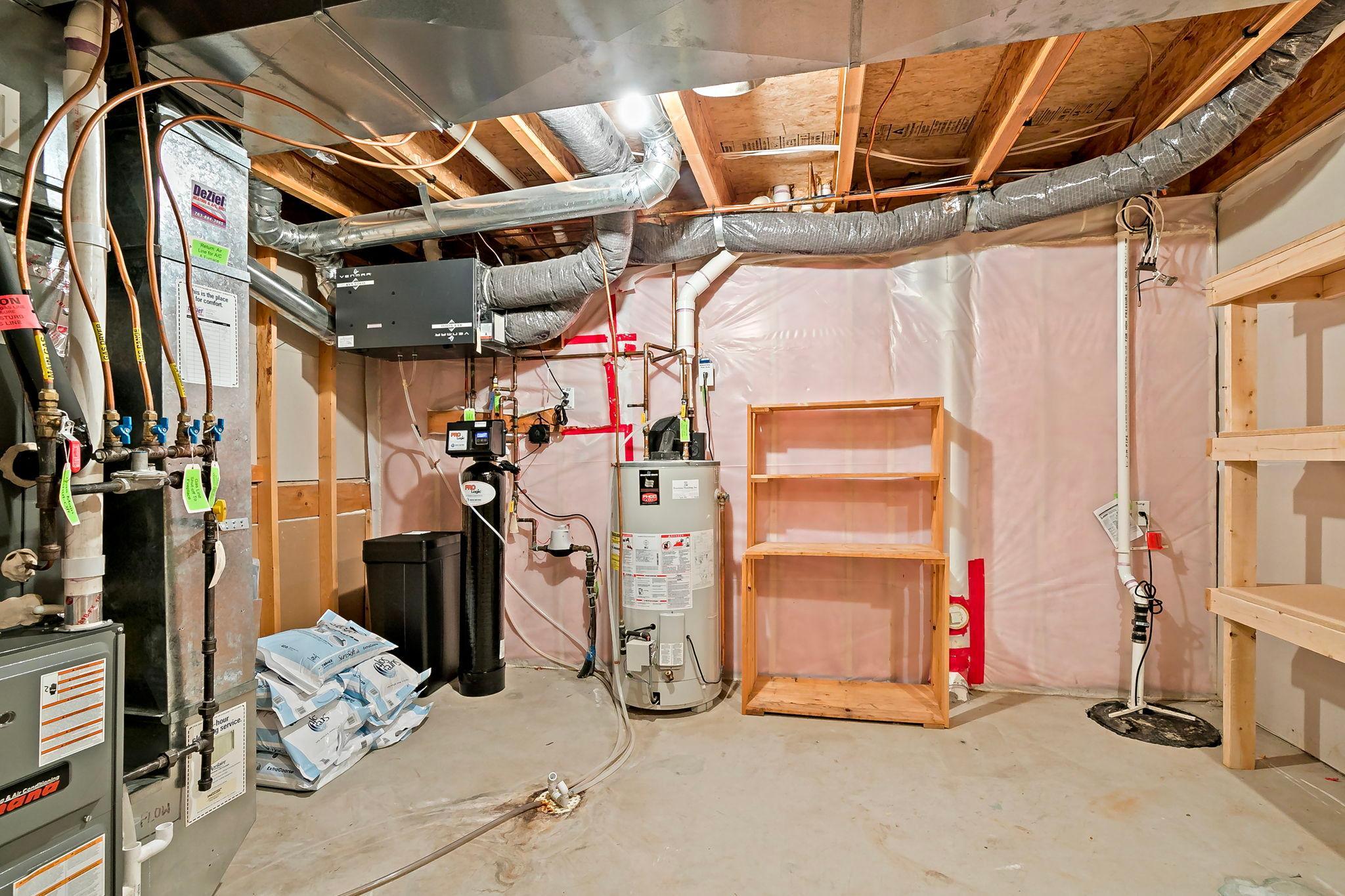 So much extra space in this mechanical room, thoughtfully expanded to add even more valuable storage options beyond its utility function.
