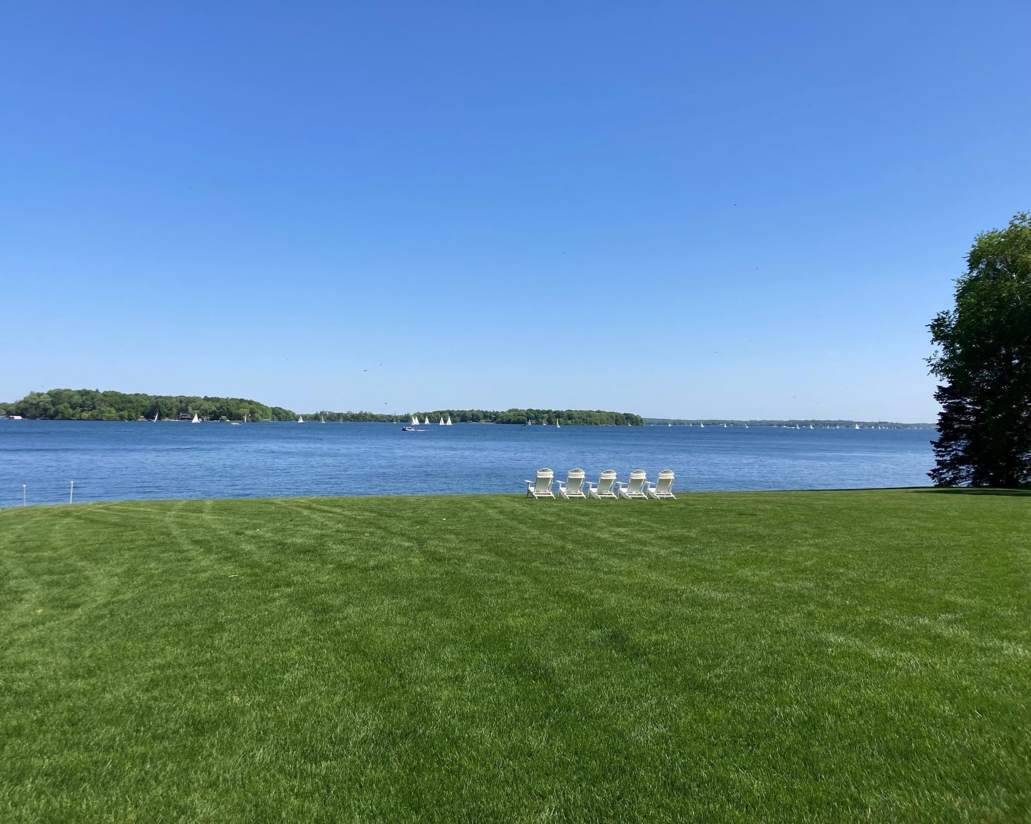 Generous in scale and beautifully positioned, this property invites effortless indoor-outdoor living and a front-row seat to the lake from every angle.