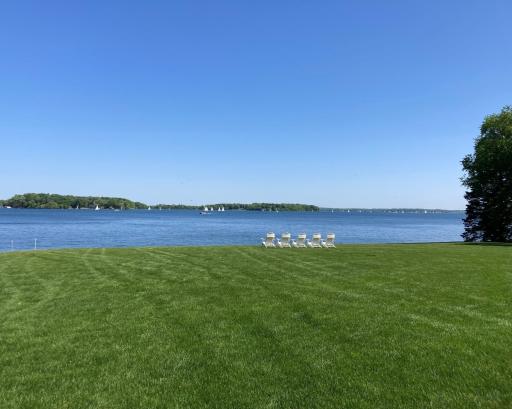 Generous in scale and beautifully positioned, this property invites effortless indoor-outdoor living and a front-row seat to the lake from every angle.