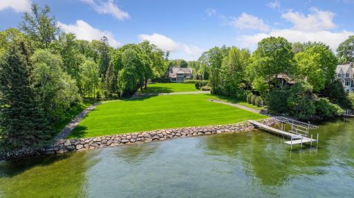 Nestled at the end of a quiet street, this .63 acre property offers a rare chance to build your dream home on the shores of Lake Minnetonka!