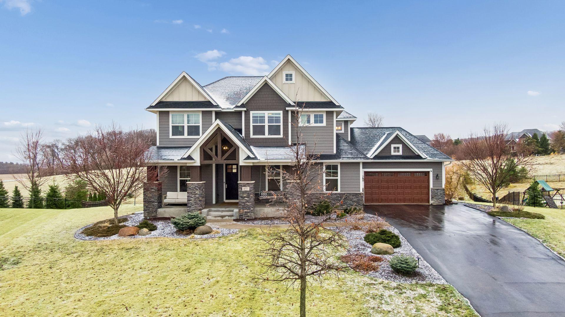 The curb appeal here is something special—beautiful color palette, architectural peaks, and a welcoming front entry that sets the tone.