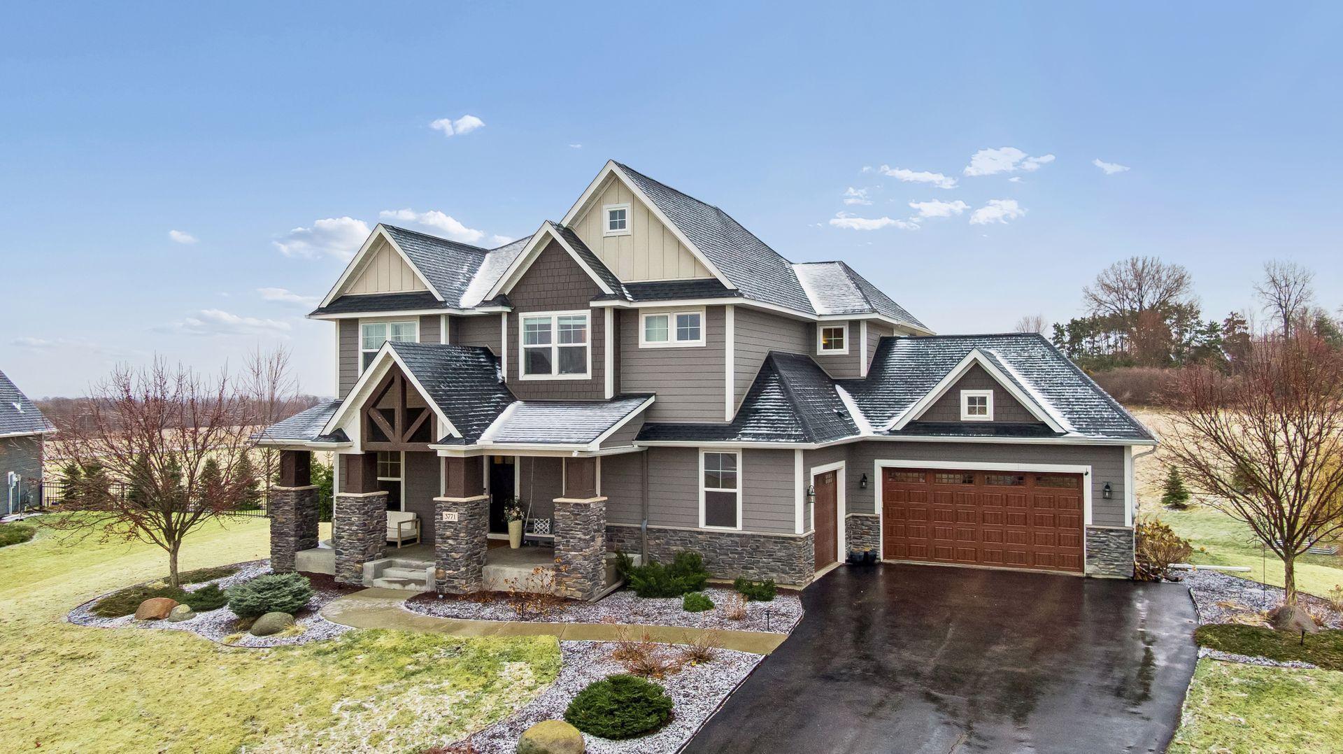 From the three-car garage to the thoughtful landscaping, every detail of this exterior was designed to impress.