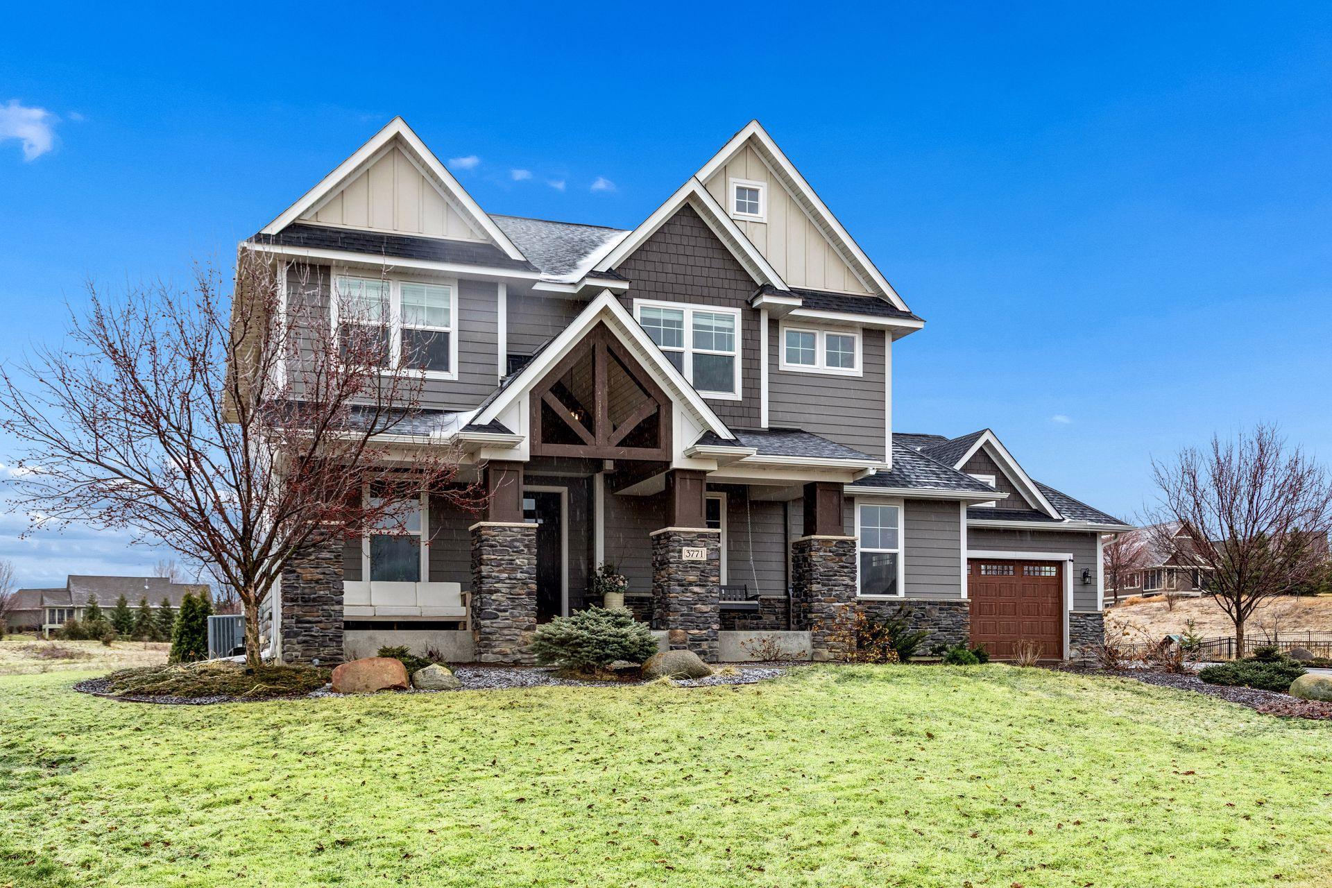 Timeless siding choices and thoughtful design details give this home a refined, elevated look.