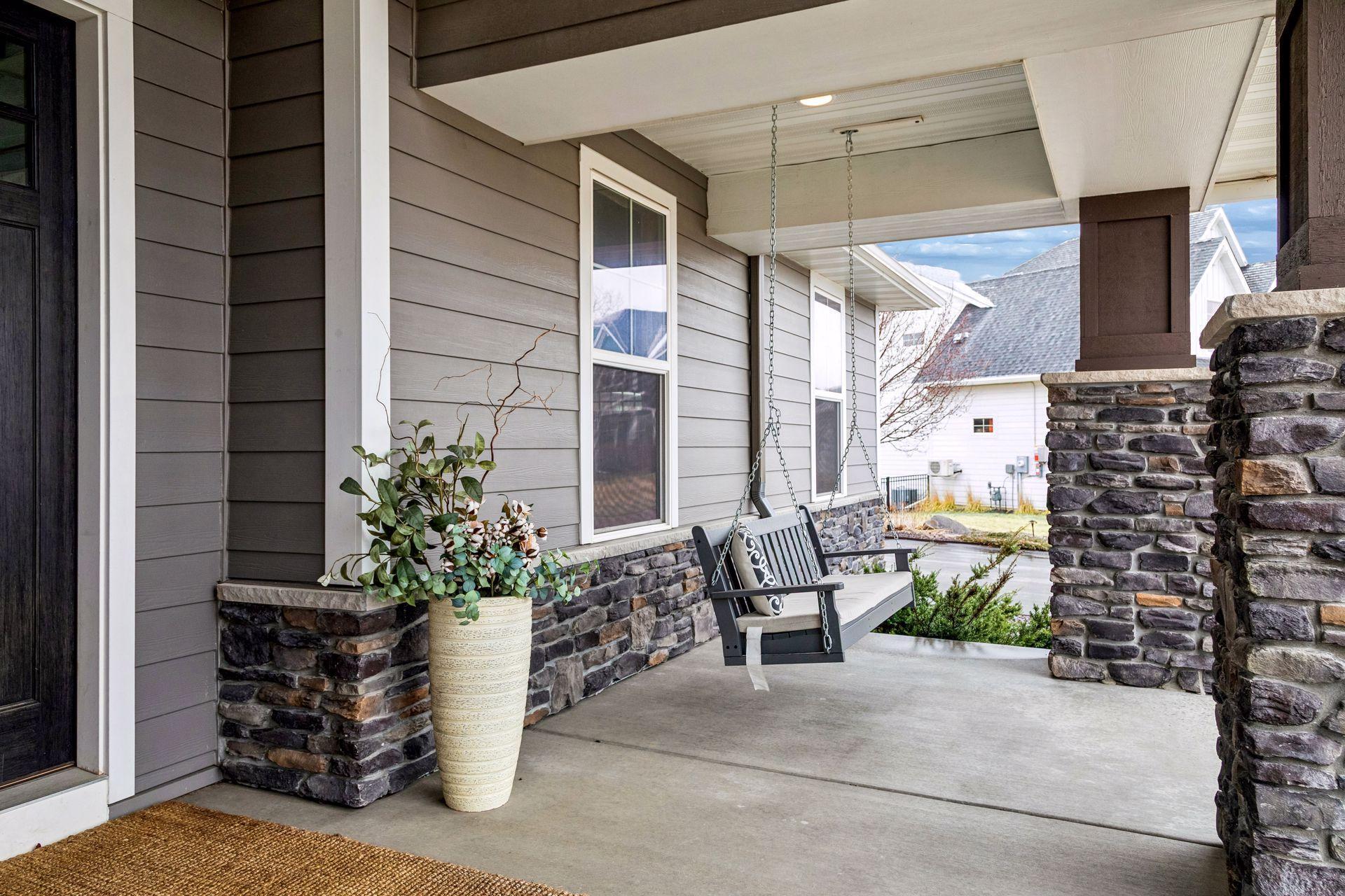 This front porch was made for slow mornings, evening chats, and welcoming guests.