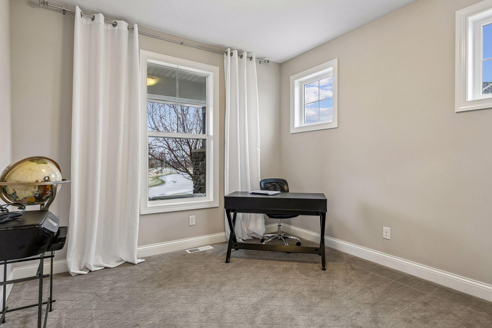 A versatile space with great light—ideal for a home office, reading room, or den.