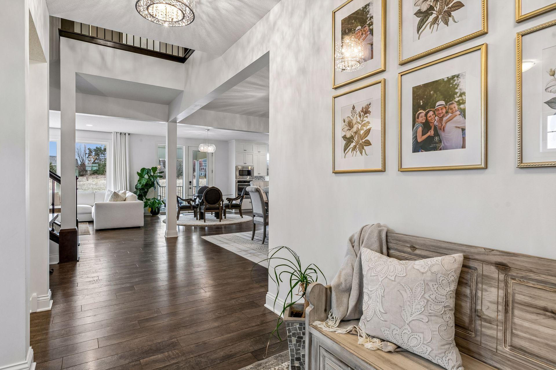 Warm wood floors and cohesive finishes create a beautiful, welcoming flow throughout the main level.