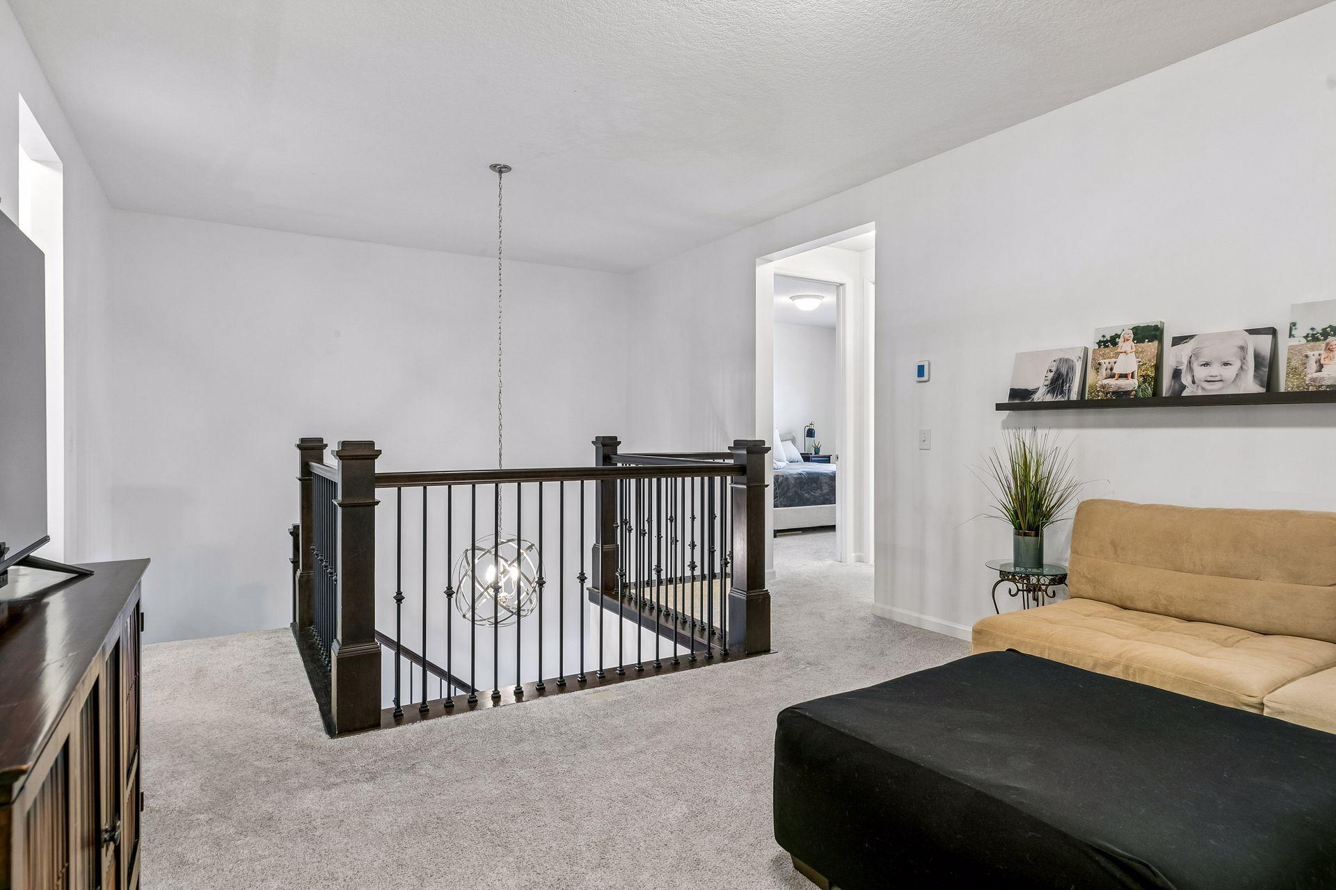 The central hub of the upper level, connecting all bedrooms with a functional and inviting layout.