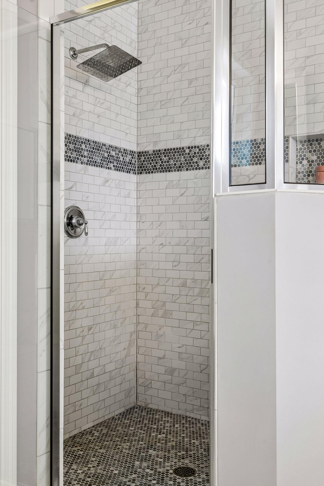 A spacious shower designed with both style and function in mind.