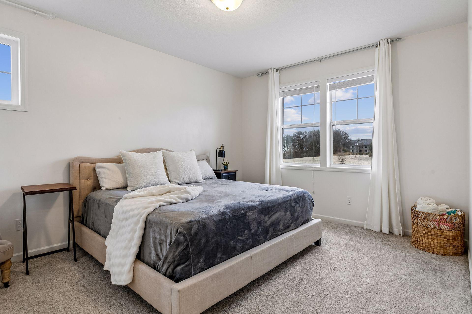 A bright guest room complete with a large walk-in closet.