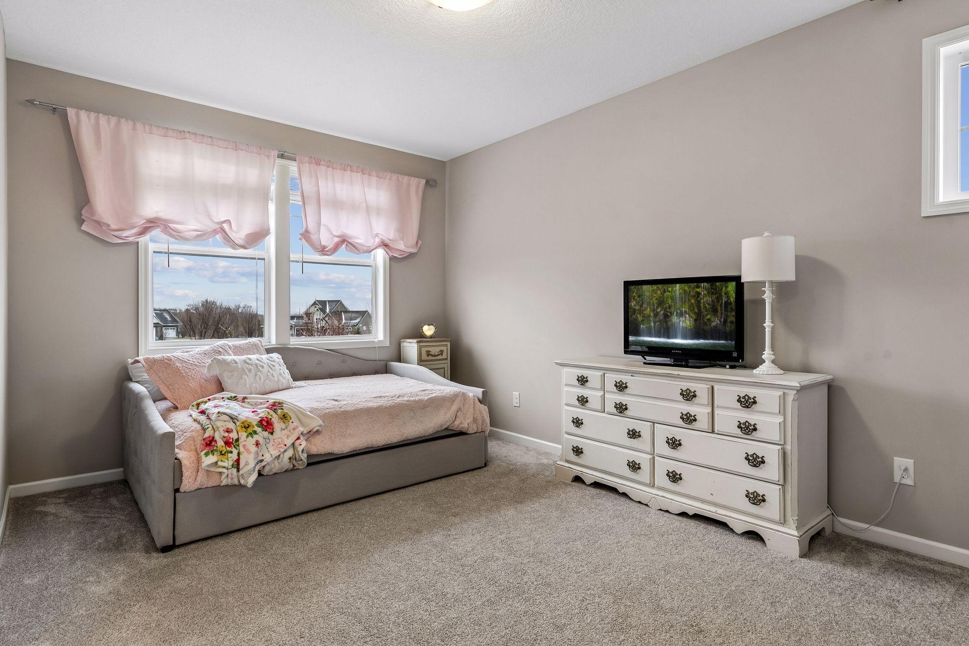 A well-designed bedroom with direct access to a Jack-and-Jill bathroom.