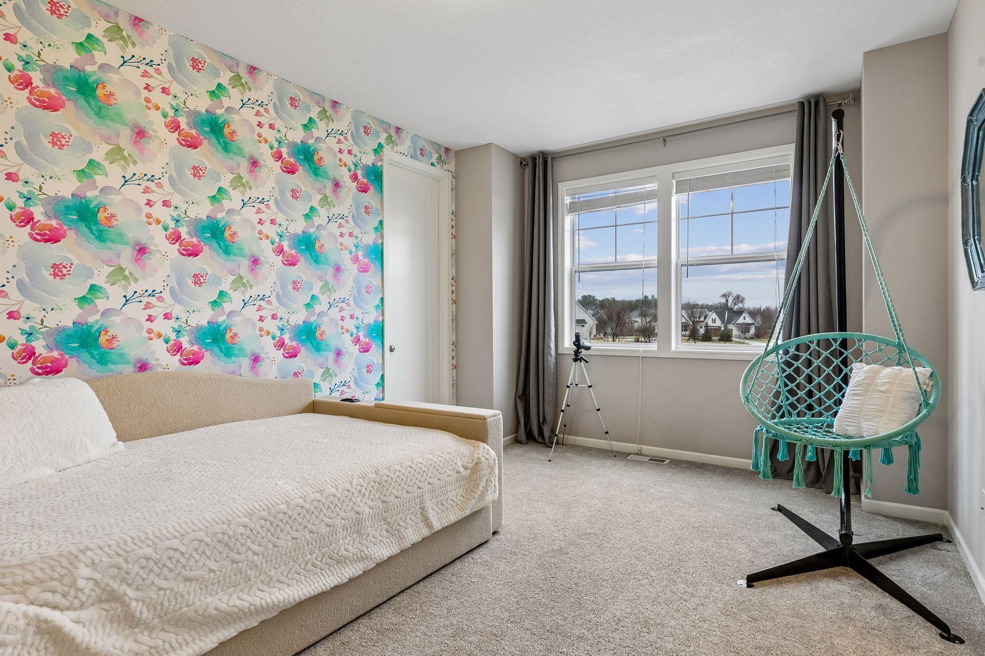 A spacious fourth bedroom with a large walk-in closet and great natural light.